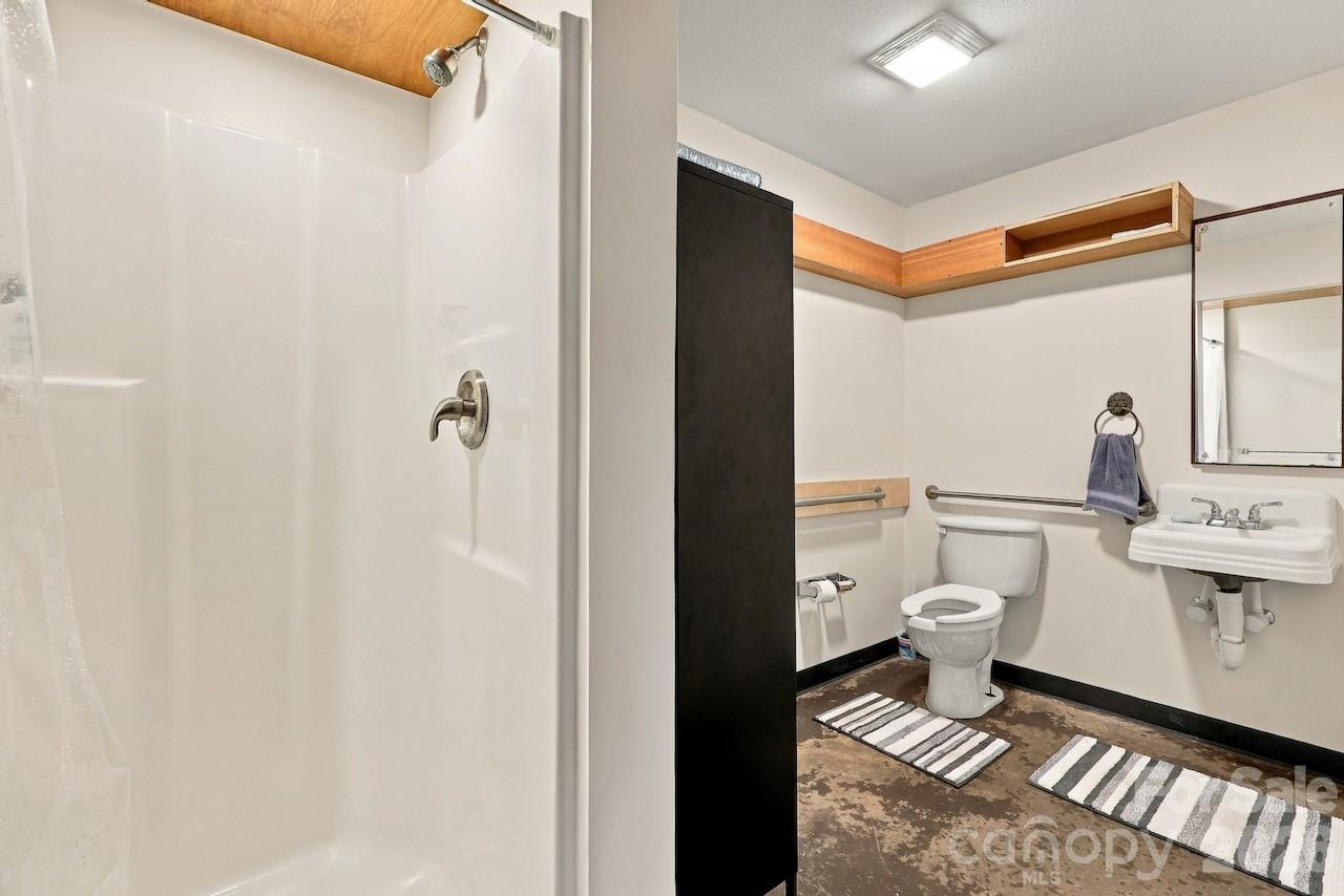 1st floor bathroom with laundry hookups in place - 297 Hillside Street, Asheville