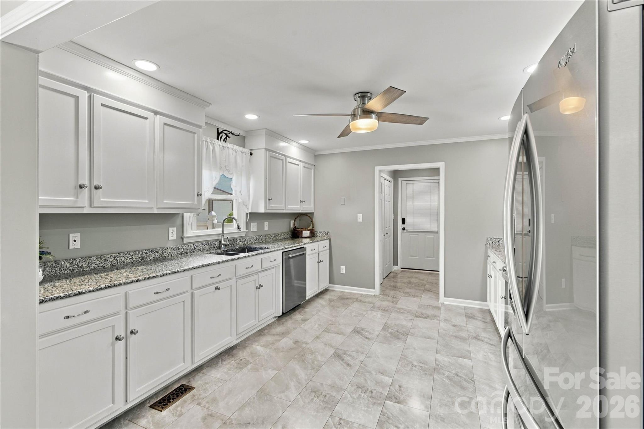 Gorgeous Kitchen has been updated and is very spacious. Laundry Room is located in the Mud Room at the far end of the picture. - 643 Shoal Road, Lincolnton