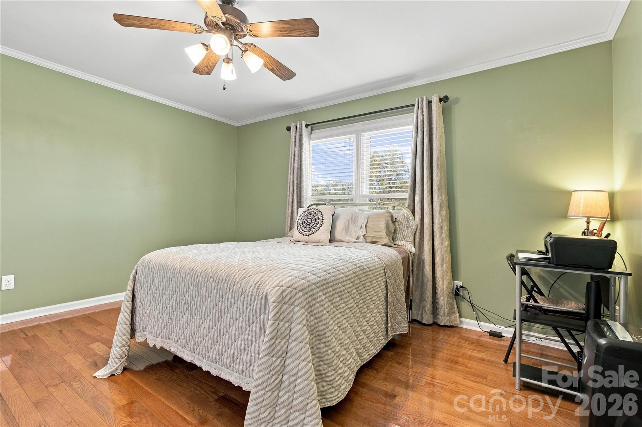 Another view of second bedroom also featuring gleaming hardwood floors and ceiling fan - 643 Shoal Road, Lincolnton