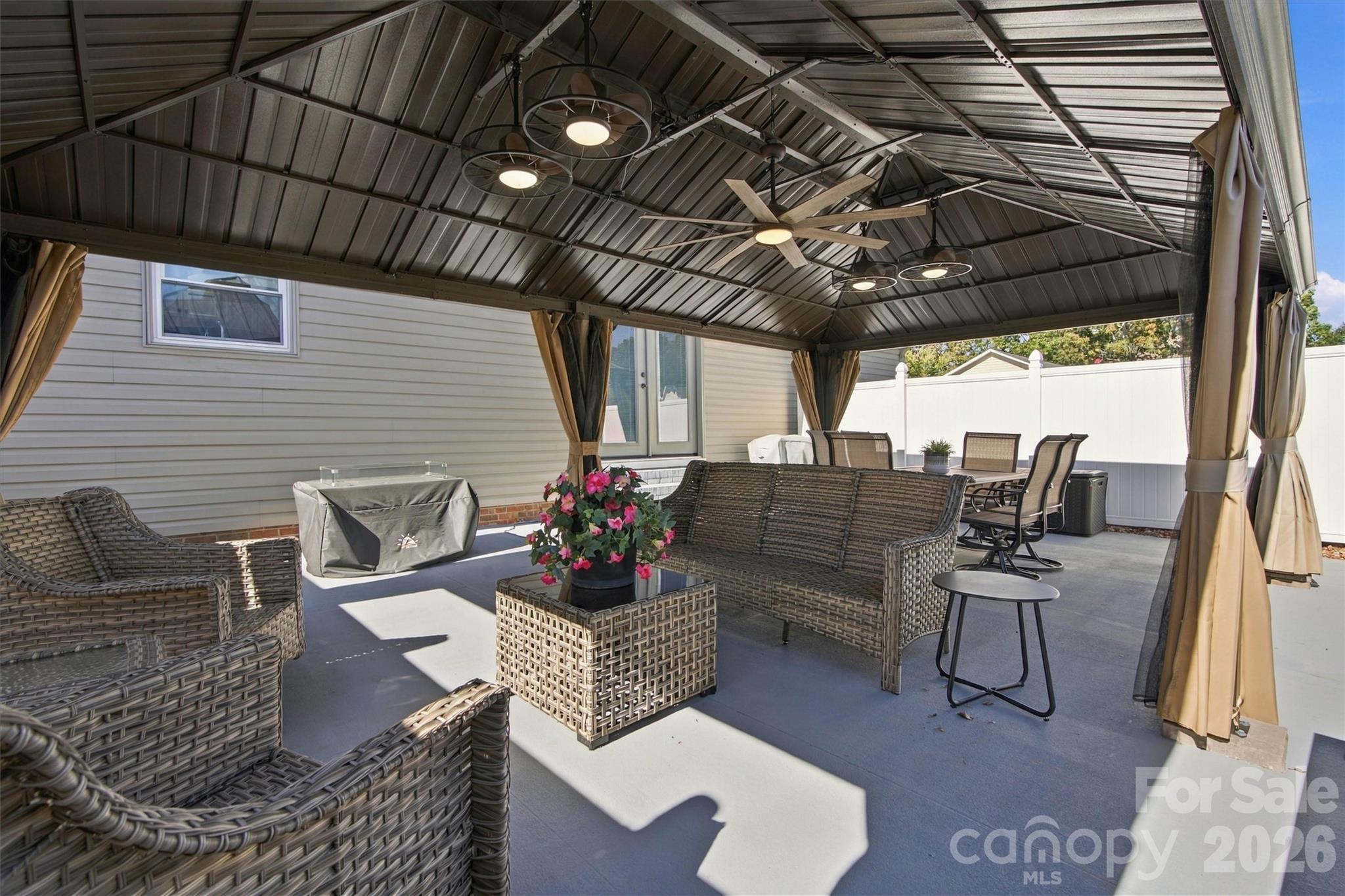14'x24' Gazebo inside fenced rear Patio features 5 ceiling fans and a ton of space for entertaining! - 643 Shoal Road, Lincolnton