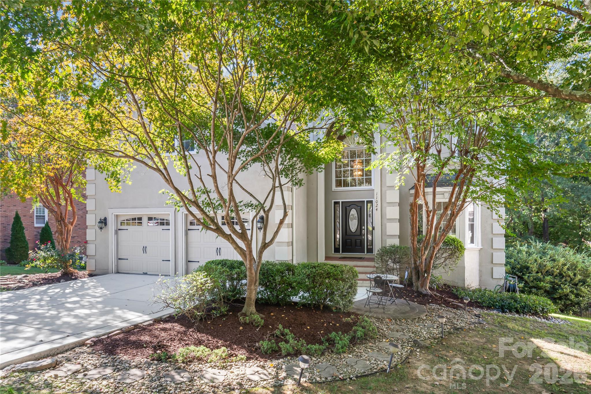 Tucked into nature right in the heart of Ballantyne...enjoy total peace, shade, and privacy surrounded by a lush canopy of mature trees. - 11024 Stonepath Lane, Charlotte