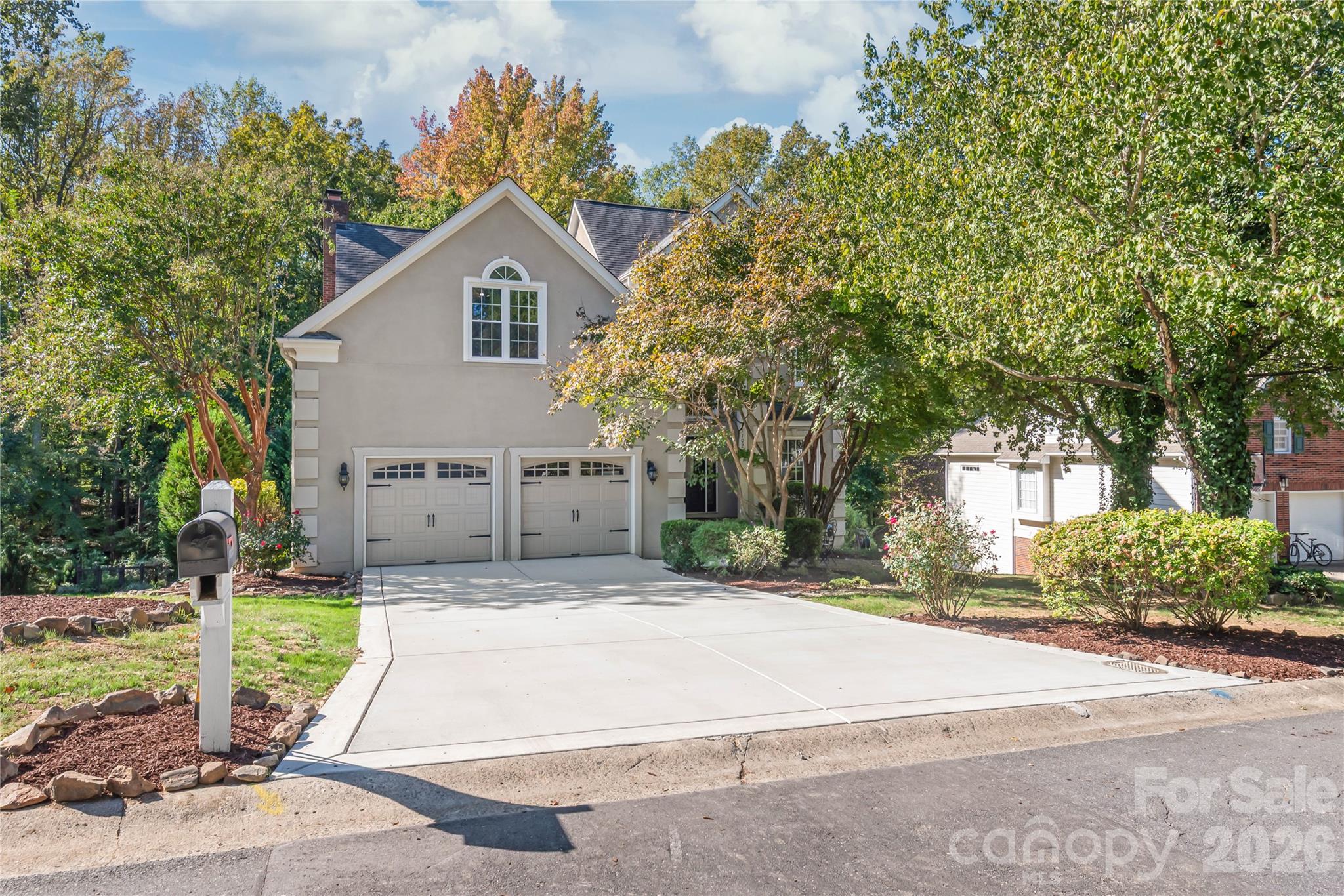 Curb appeal - Brand-new driveway installed in 2026, offering pristine parking and a polished welcome home. - 11024 Stonepath Lane, Charlotte
