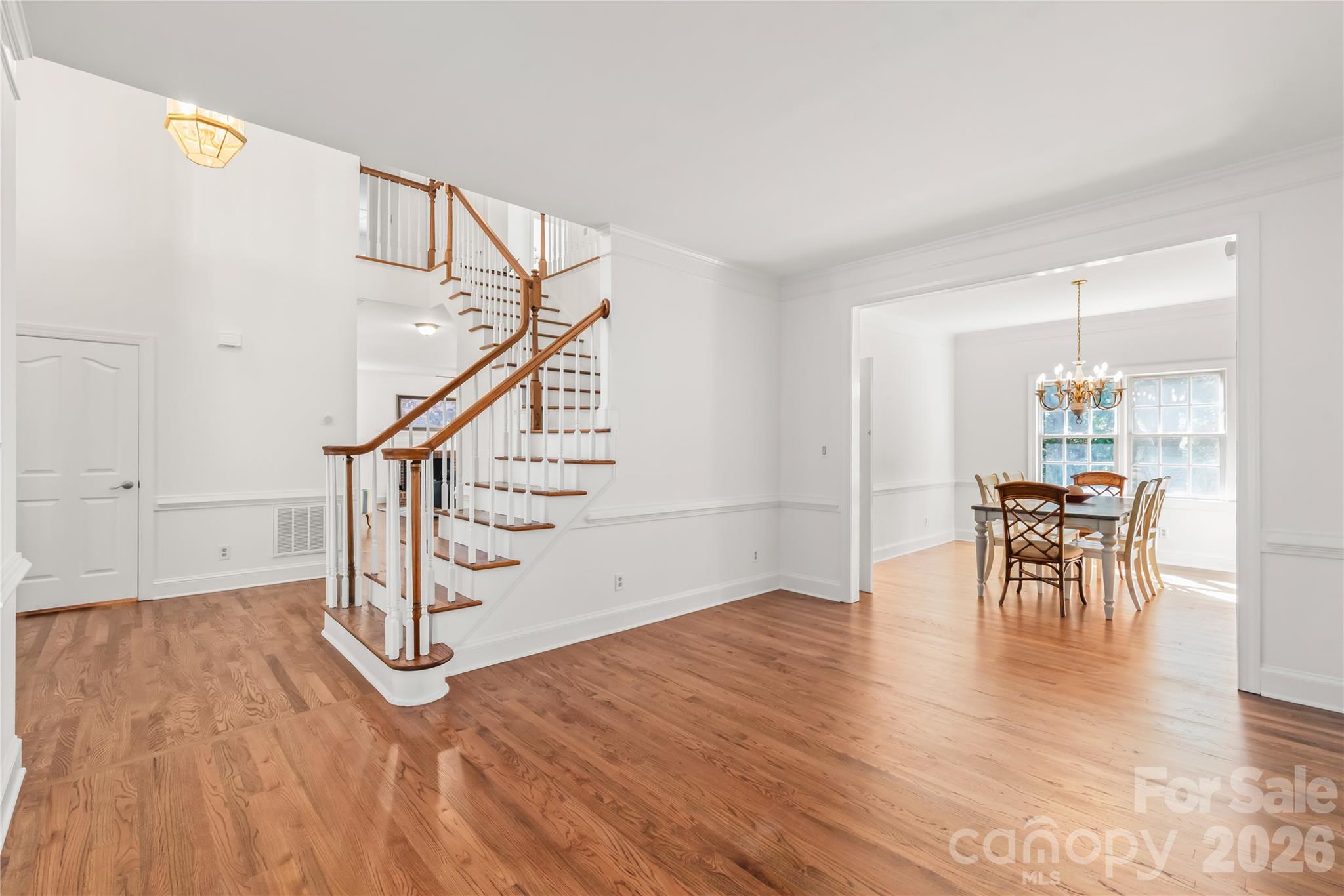 Rich, seamless, and completely timeless - brand new 2026 site-finished hardwood floors span the entire main level for an elevated, cohesive finish. - 11024 Stonepath Lane, Charlotte