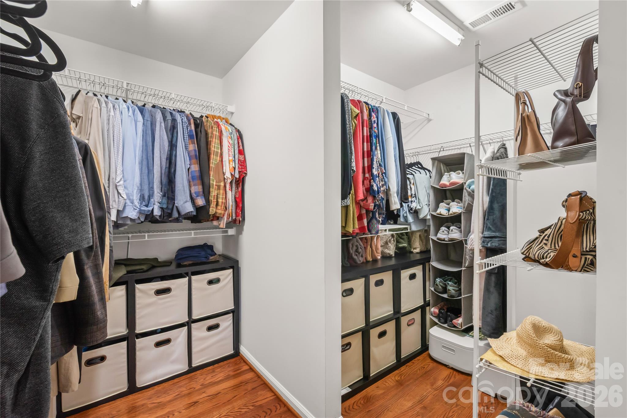 This spacious walk-in closet delivers generous hanging space, easy organization, and effortless day-to-day convenience. - 11024 Stonepath Lane, Charlotte