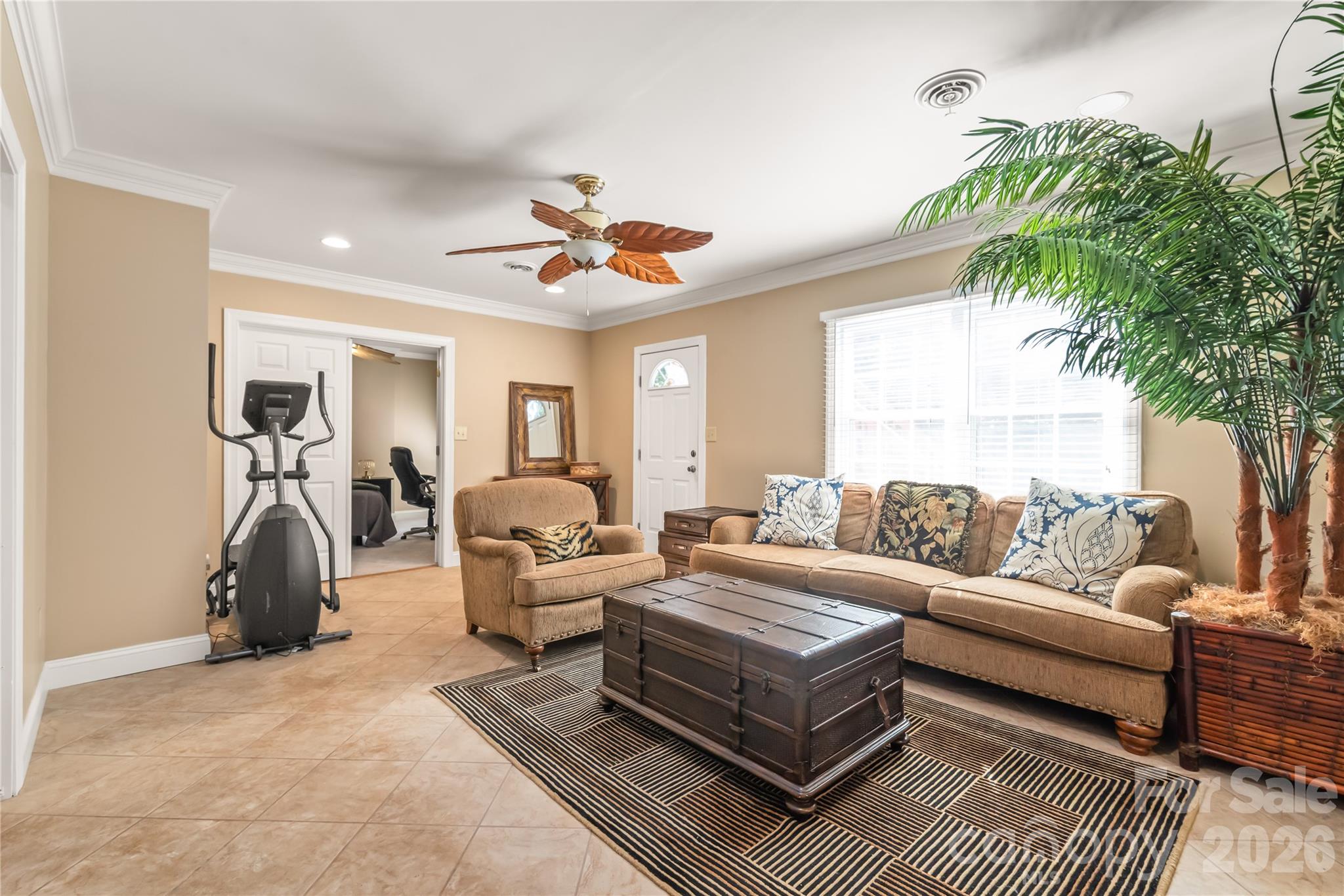 The walk-out basement boasts a 5th bedroom, dedicated home office, full bathroom, living area, and media room. - 11024 Stonepath Lane, Charlotte