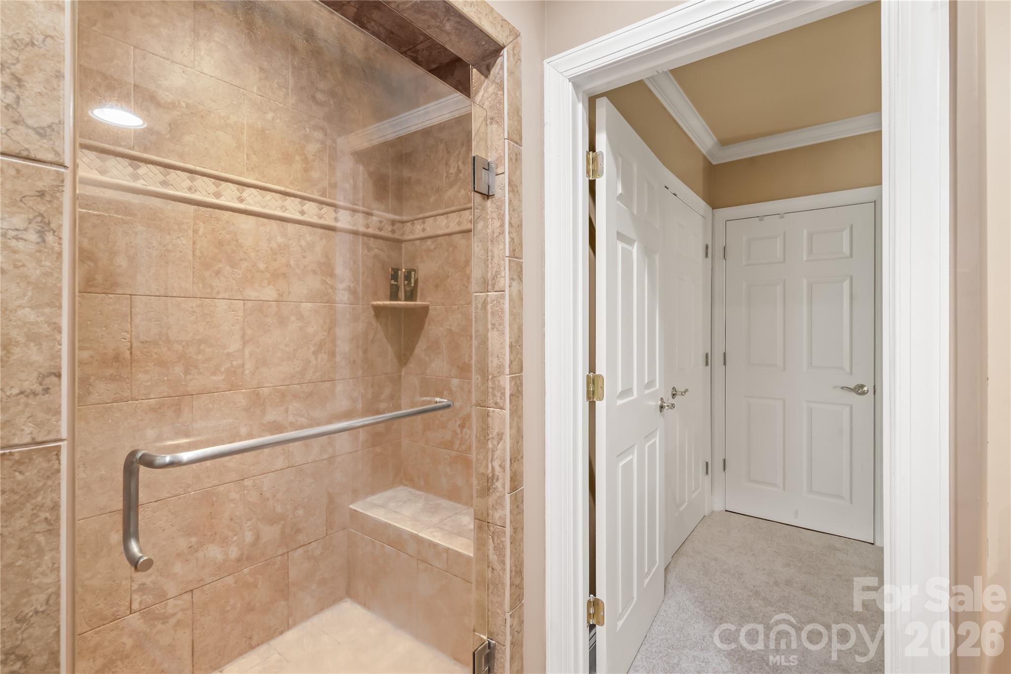 The walk-in shower offers clean lines and effortless access for a refreshing. - 11024 Stonepath Lane, Charlotte
