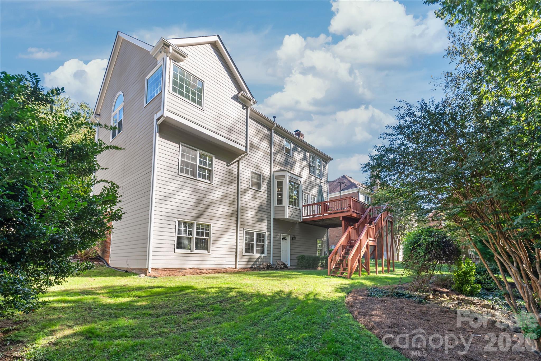 Step straight from the walk-out basement into the private backyard, making outdoor entertaining and everyday relaxation effortless. - 11024 Stonepath Lane, Charlotte