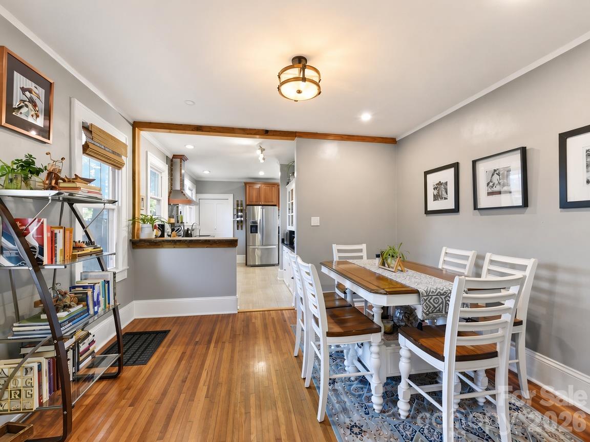 Breakfast bar features a live edge wood top - 415 West Boulevard, Charlotte