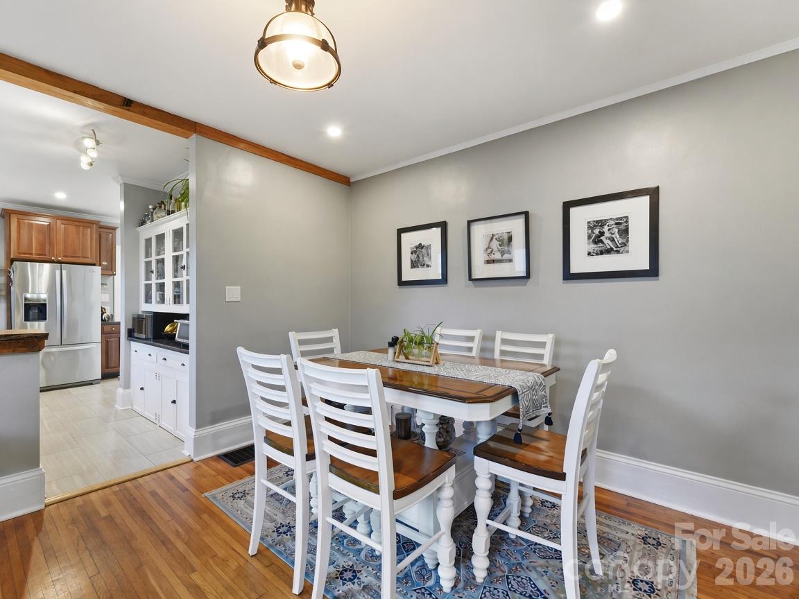 Opened up wall between dining room and kitchen with support beam added - 415 West Boulevard, Charlotte