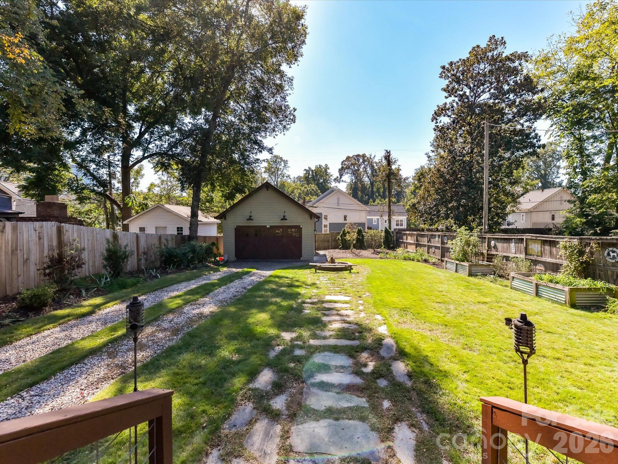 Paver stones leading to the fire pit and custom garage / workshop - 415 West Boulevard, Charlotte