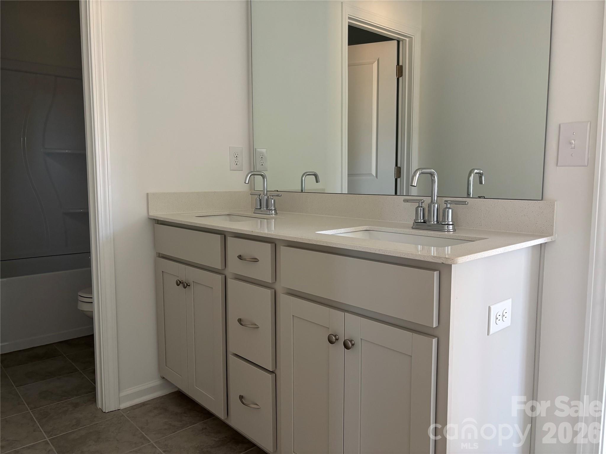 Here is the jack n jill bath =) Full Bath with another door between where the sink area is and tub n toilet =) - 1717 Grassy Knoll Trail, Maiden