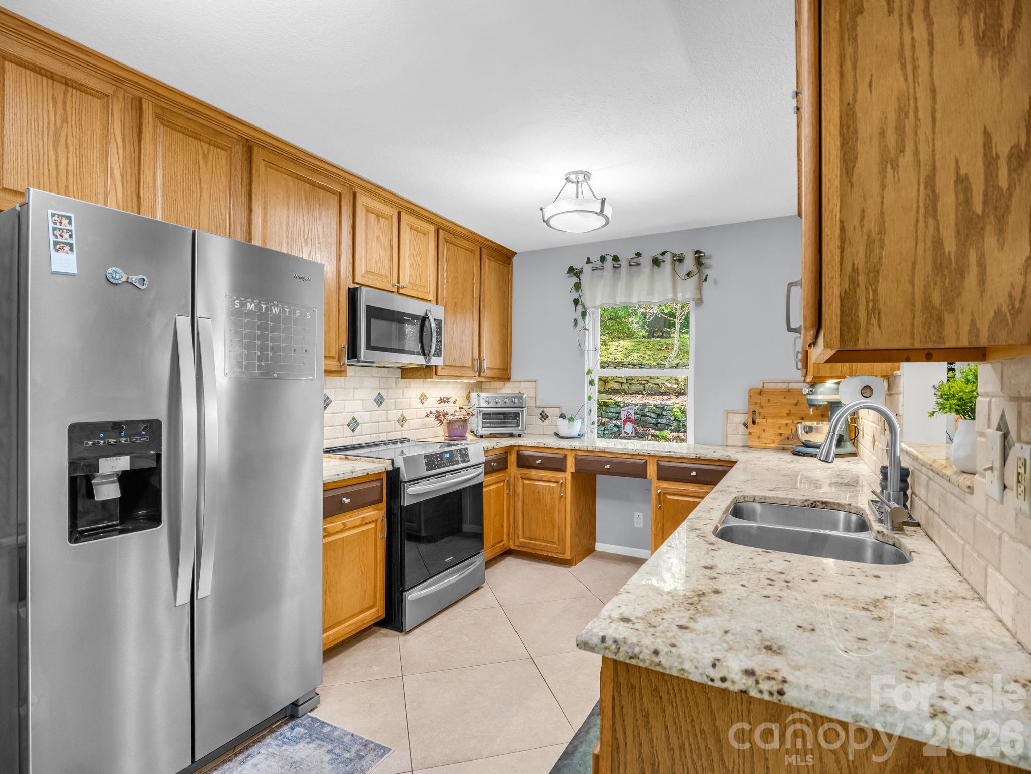 Kitchen with newer stainless appliances. - 178 Hilltop View Drive, Fletcher