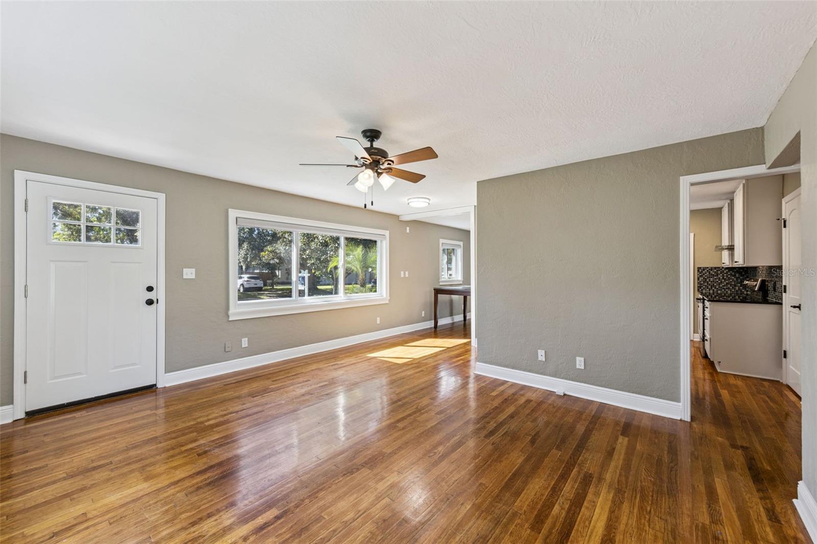 Original hardwood floors and new windows make for a great family room - 3115 HARGILL DR, ORLANDO