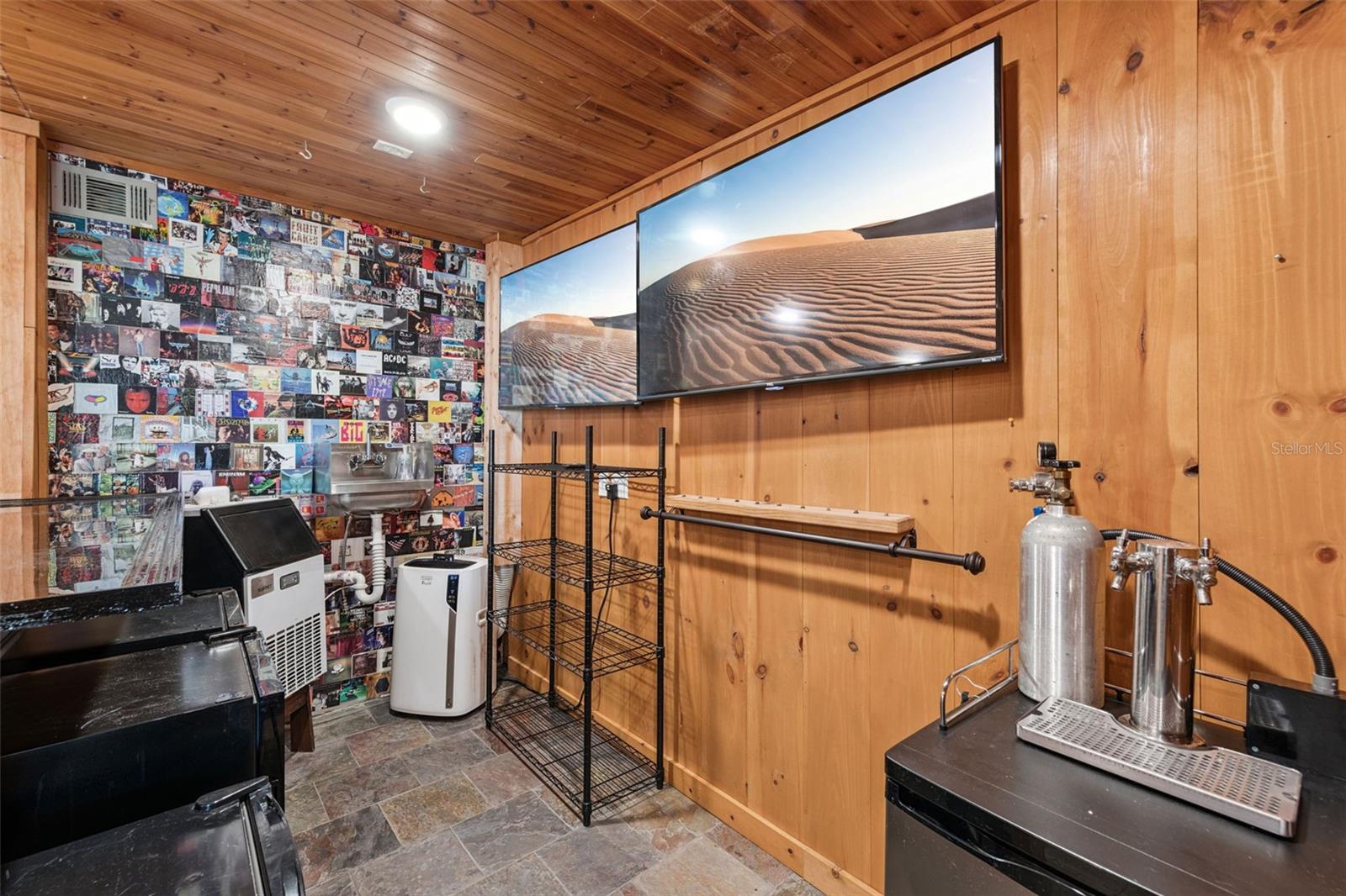 Another view of the bar set up with Ice Machine, Air conditioner, Sink, Kegerator, Wine Fridge and 2 additional fridges for your cans and glassware. This space is ready to entertain ! - 3115 HARGILL DR, ORLANDO