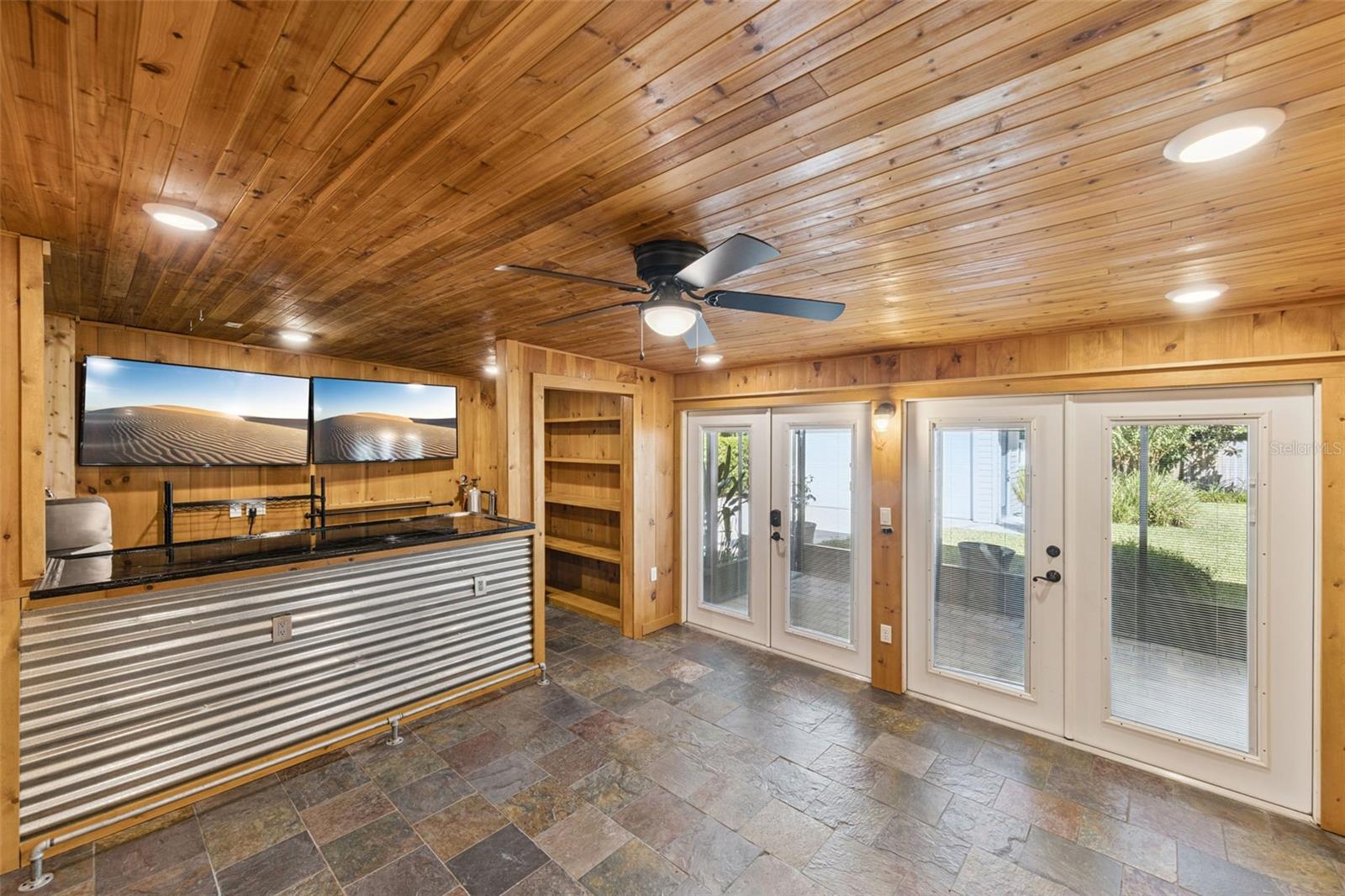 Gameroom has 2 sets of French doors that open into a large screen porch and private fenced backyard. - 3115 HARGILL DR, ORLANDO