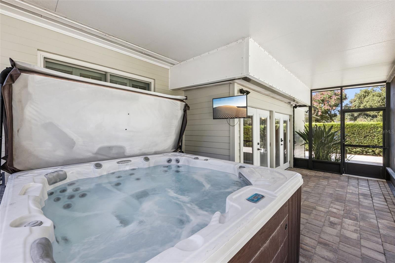 Large Screen porch with hot tub is right off the bar area. - 3115 HARGILL DR, ORLANDO