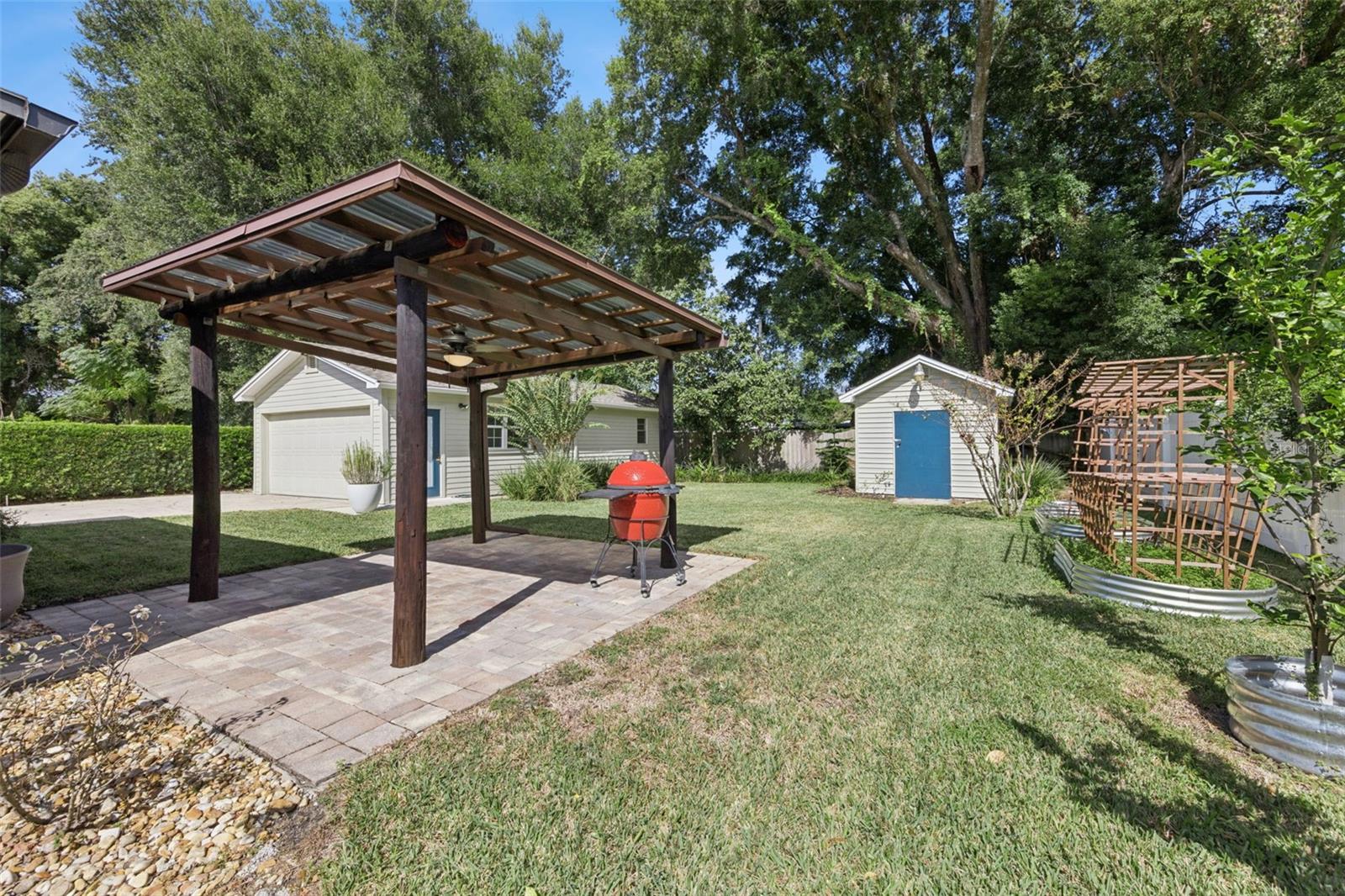 Covered Grilling Gazebo, 12x12 Shed and Fruit trees and lots of pineapples are back here too. - 3115 HARGILL DR, ORLANDO