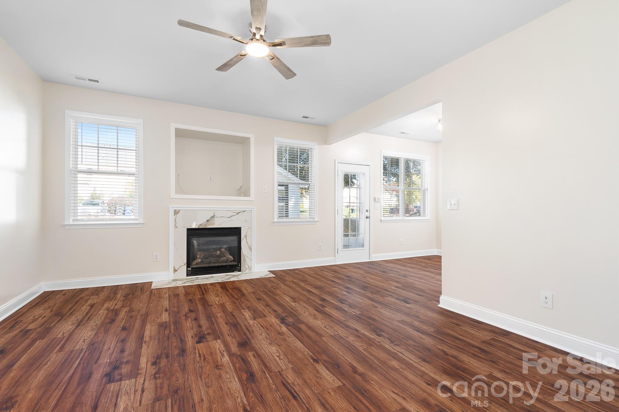 Open Living Area with Gas Fireplace, New Quartz Surround, New Blinds - 15404 Crossing Gate Drive, Cornelius