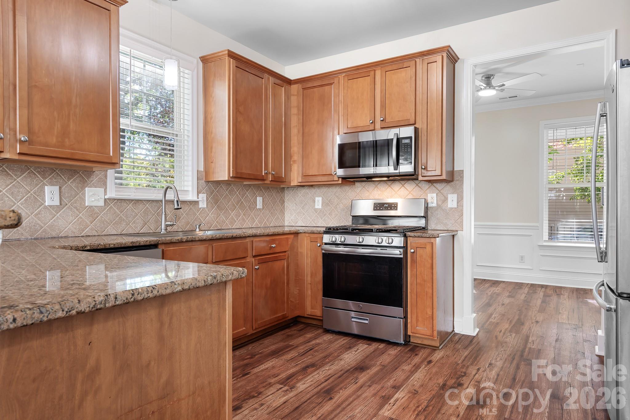 Kitchen - Tall Cabinets, Granite and Stainless Appliances - 15404 Crossing Gate Drive, Cornelius