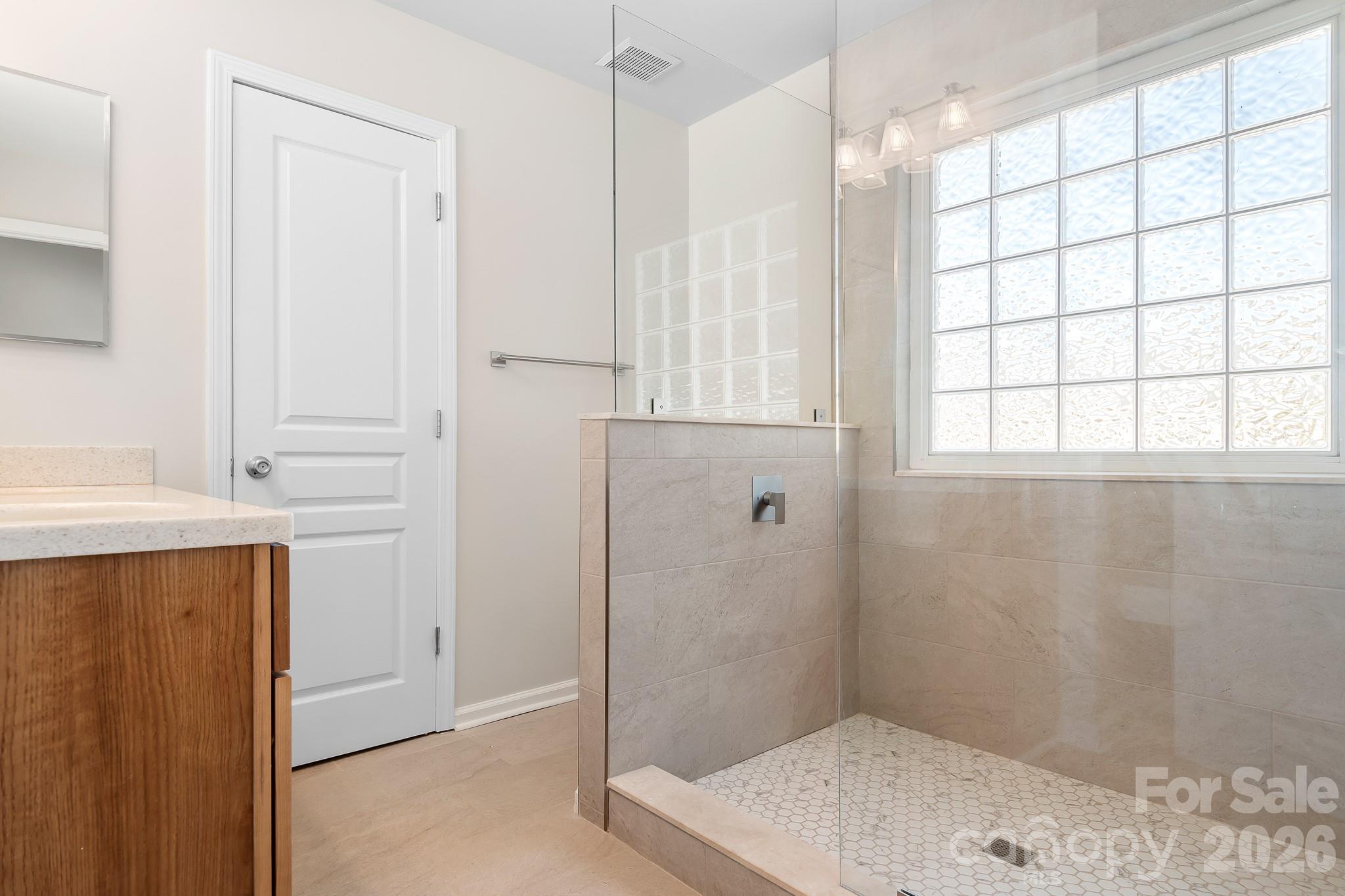 New Walk-In Shower, Glass Enclosure, Tile Flooring- included in the Walk-In Closet - 15404 Crossing Gate Drive, Cornelius