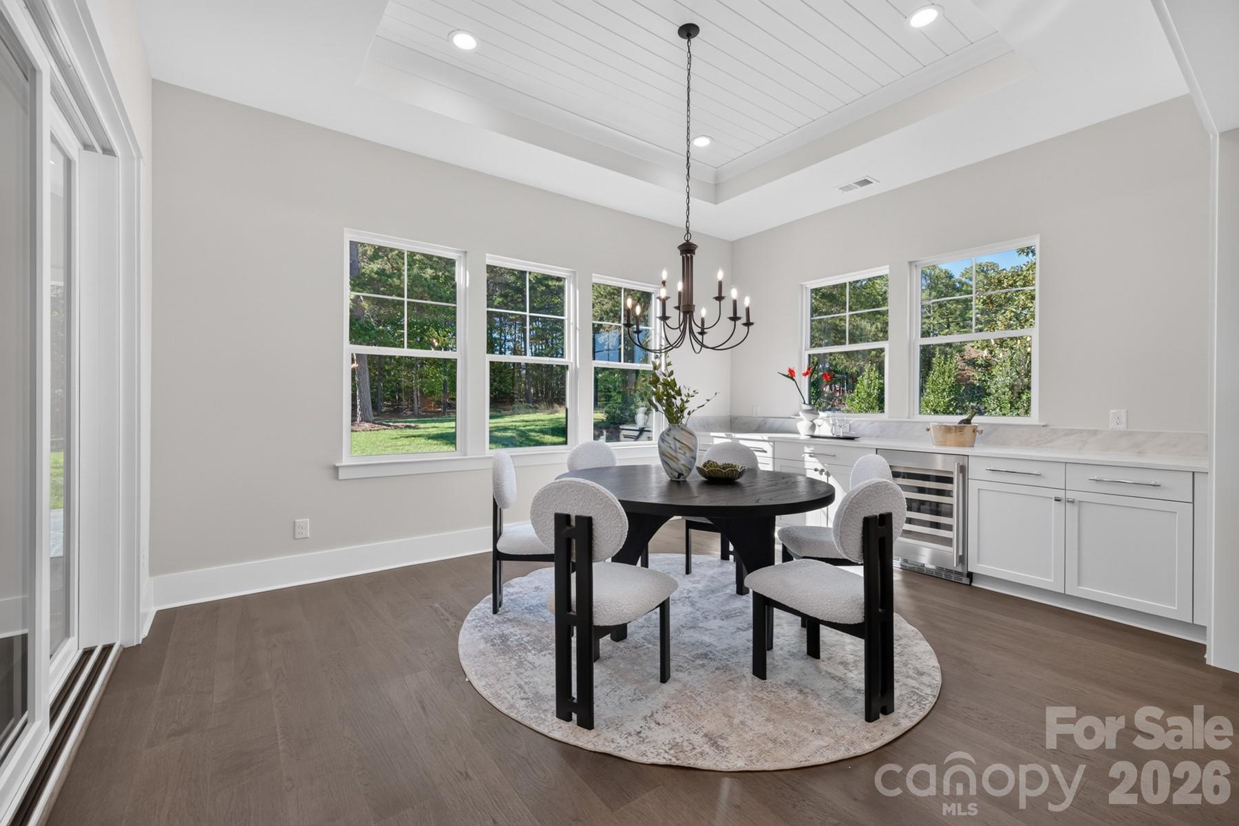 Formal Dining with built in cabinets & wine fridge - 128 Willow View Loop, Davidson