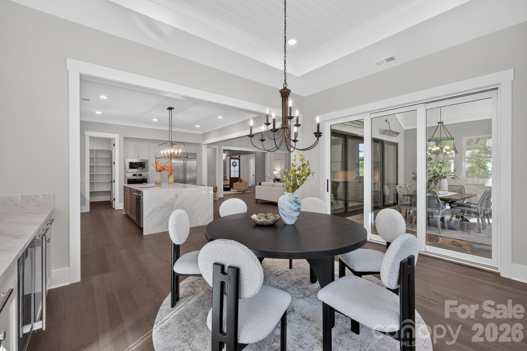 Formal Dining leads to Outdoor Terrace with multi-stack sliding doors - 128 Willow View Loop, Davidson