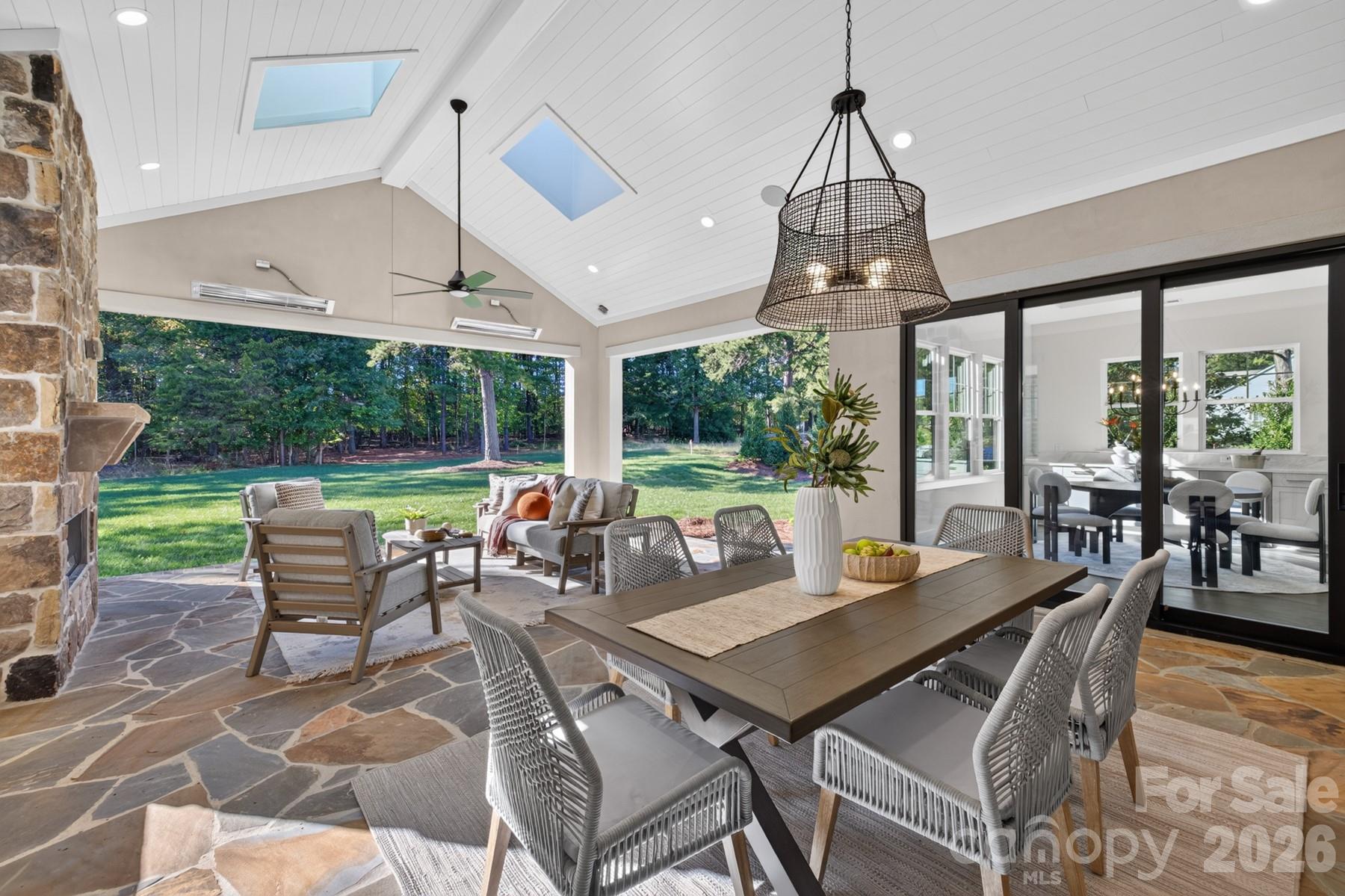 Skylights and heaters on the covered outdoor terrace - 128 Willow View Loop, Davidson