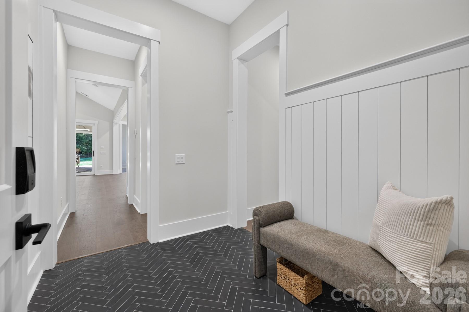 Mudroom Launch with wood detail and herringbone tilework - 128 Willow View Loop, Davidson