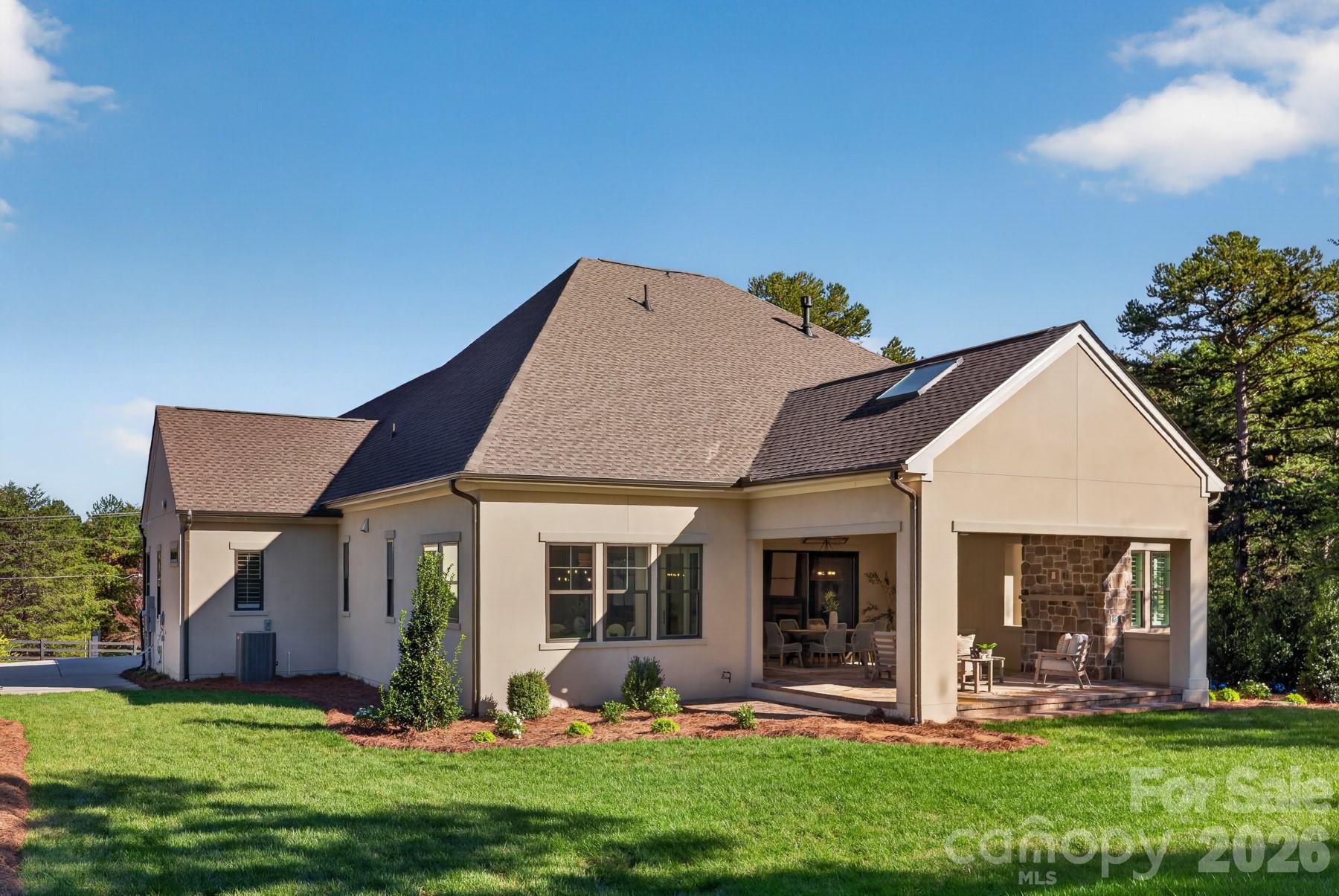 Backyard view of covered outdoor living - 128 Willow View Loop, Davidson