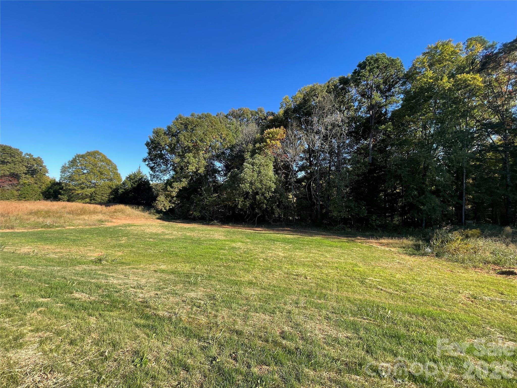 Back Yard with Wooded Area at Back of Lot for Pretty View - 130 Windstone Crossing Trail, Troutman