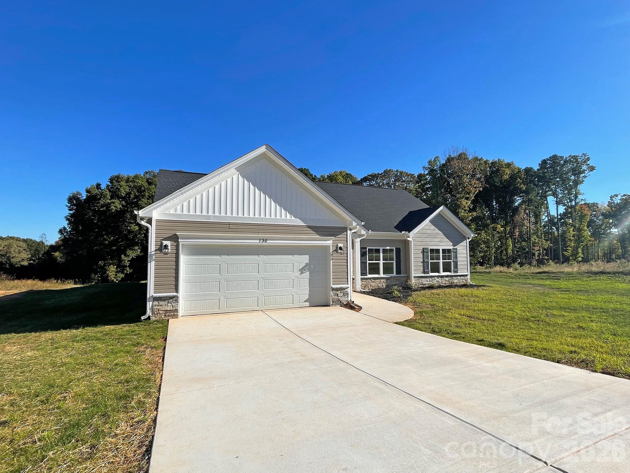 Large Concrete Driveway for Plenty of Additional Parking - 130 Windstone Crossing Trail, Troutman