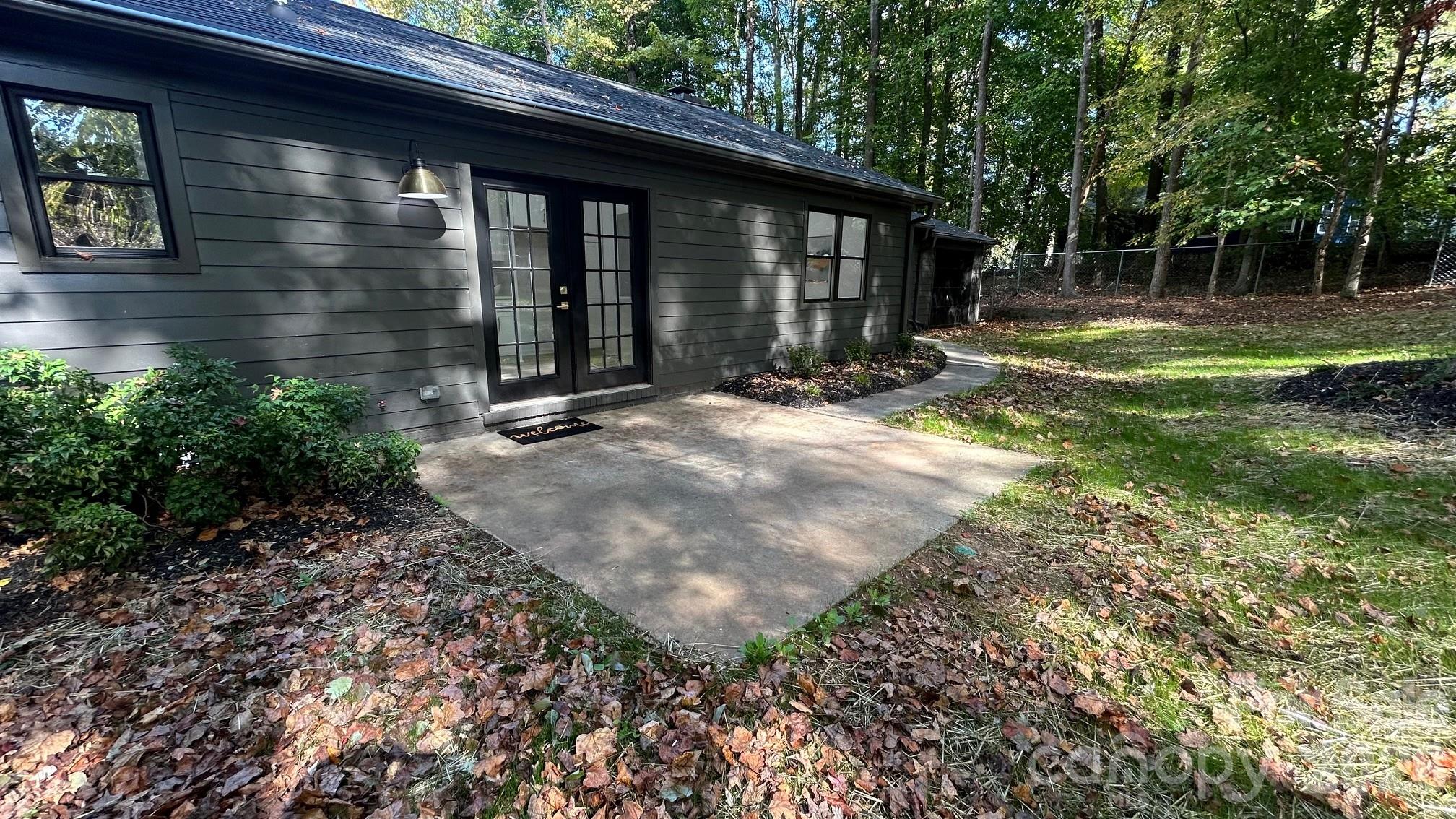 Freshly Seeded Backyard Lawn, Professional Landscaping, and New Black Mulch - 8001 Saddlehorse Lane, Charlotte