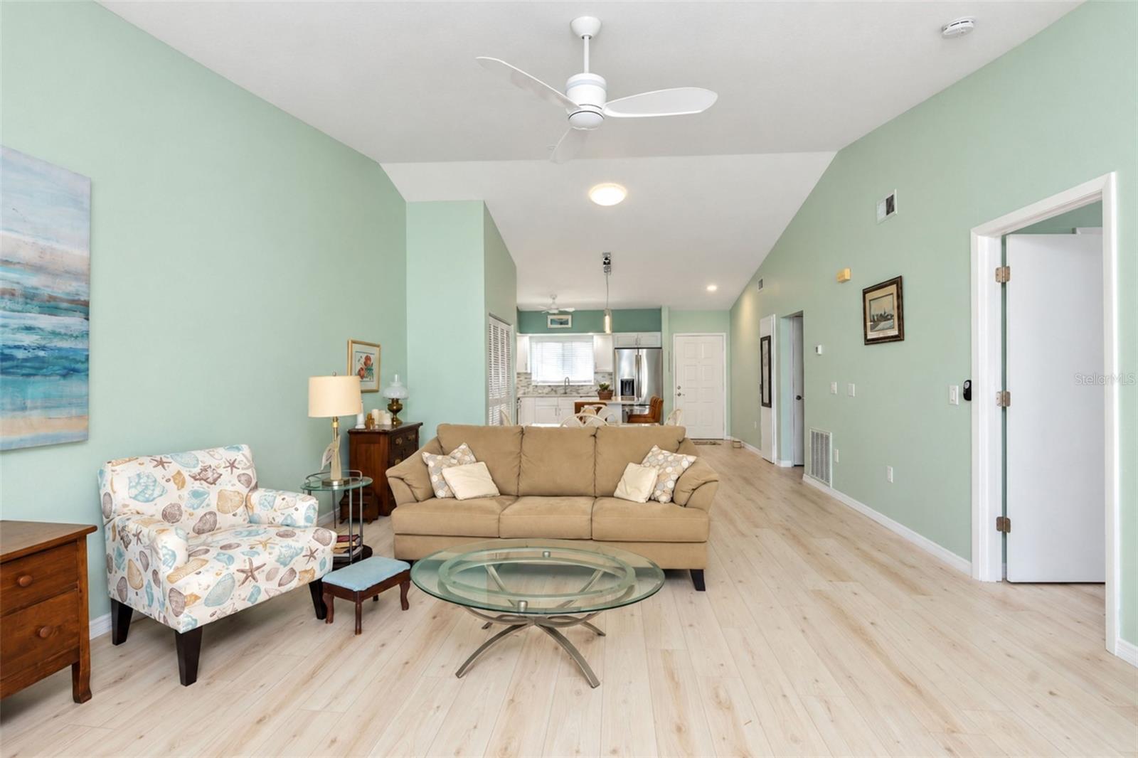 From the Florida room looking into the living/dining area and another view of the tubular skylight! - 6468 HAMLET DR #B, ENGLEWOOD