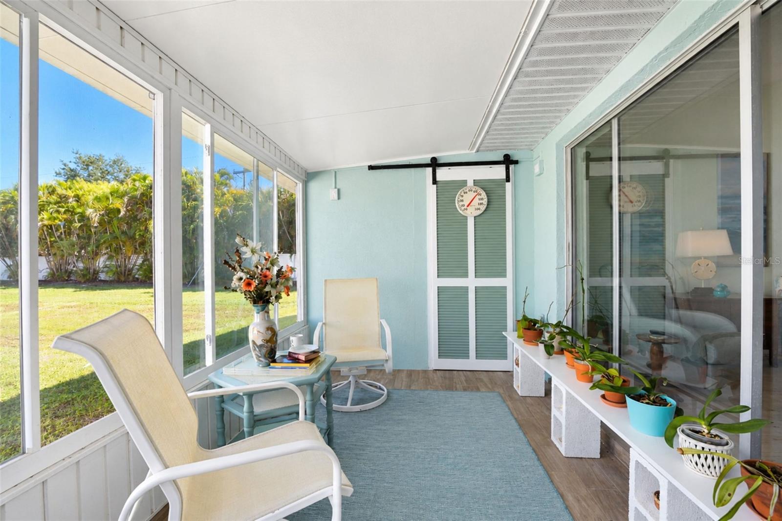 The GLASS-ENCLOSED Florida room lets you enjoy the outdoors no matter what the weather or temperature is! - 6468 HAMLET DR #B, ENGLEWOOD