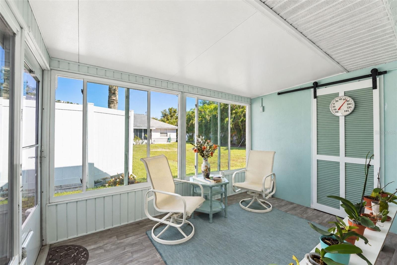 There is a door from the Florida room to rear patio. - 6468 HAMLET DR #B, ENGLEWOOD