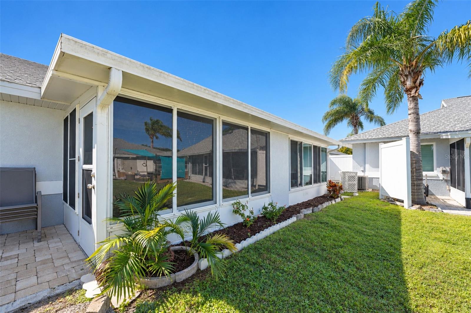 The GLASS-ENCLOSED Florida room is a great extension of your living space! - 6468 HAMLET DR #B, ENGLEWOOD