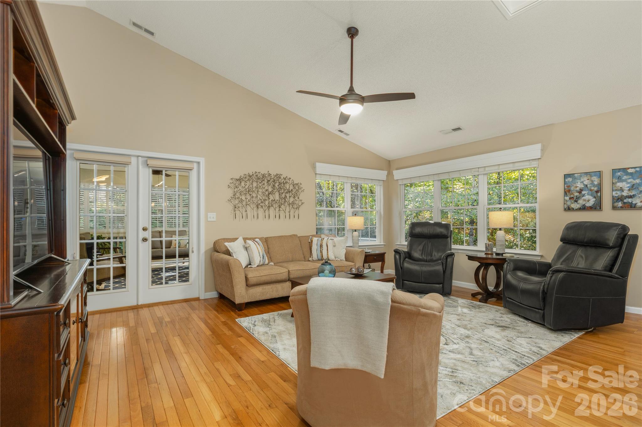 French doors leading to screen porch off of living area - 190 Fairway View Drive, Etowah