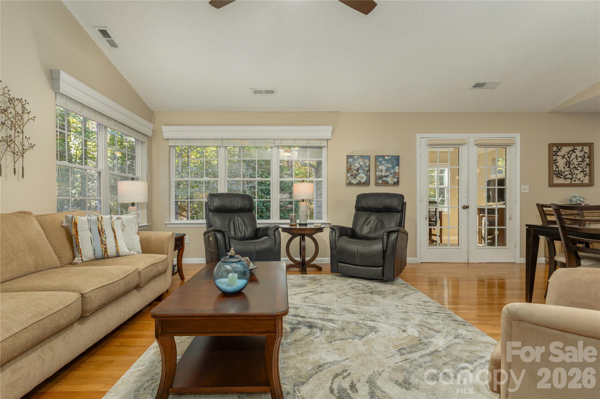 French doors leading to recently added sun room, office, or library off of living area - 190 Fairway View Drive, Etowah