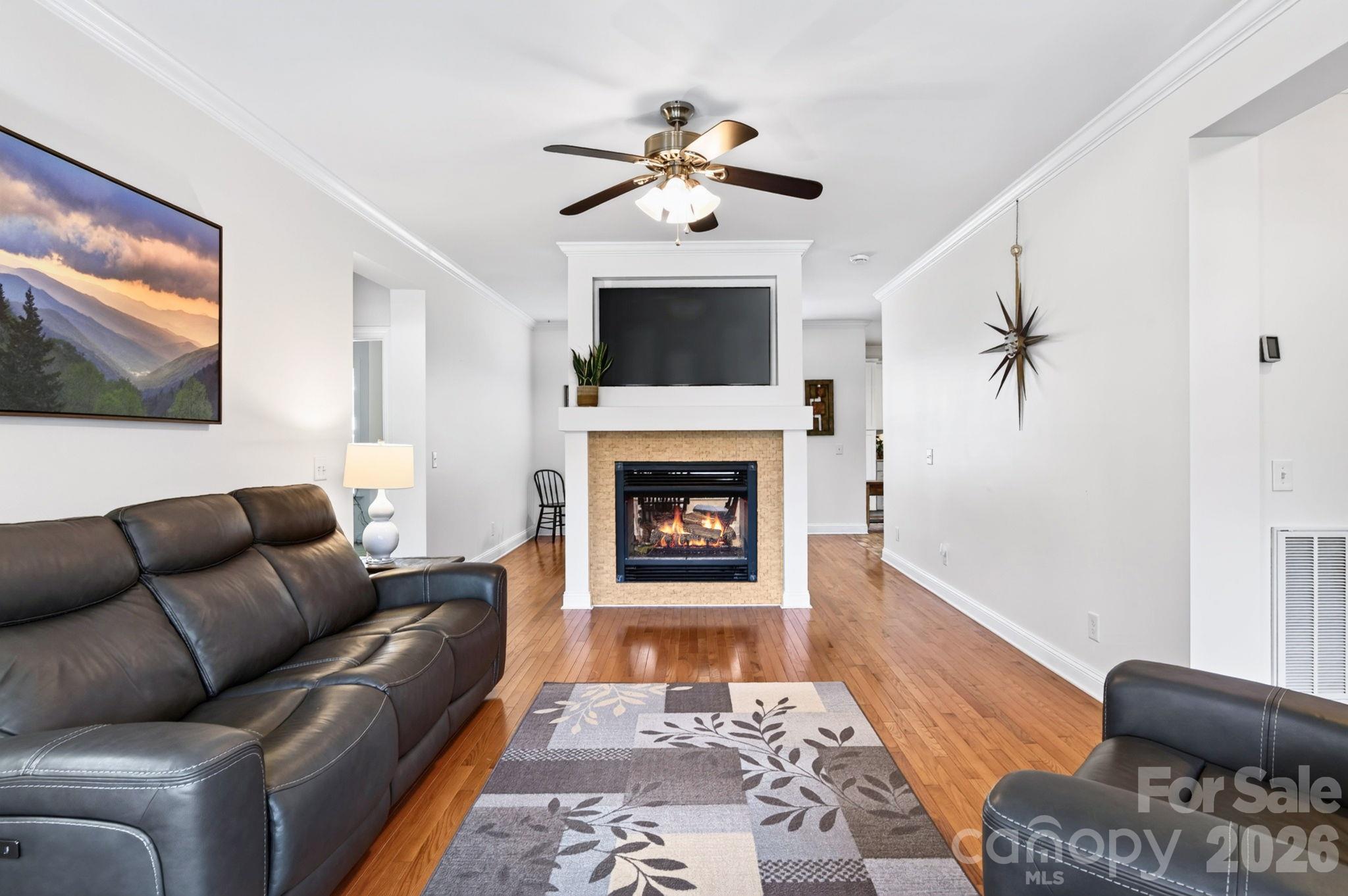 Lovely living room with high ceilings and cozy two sided gas fireplace - 10 Hominy Meadows Drive, Candler