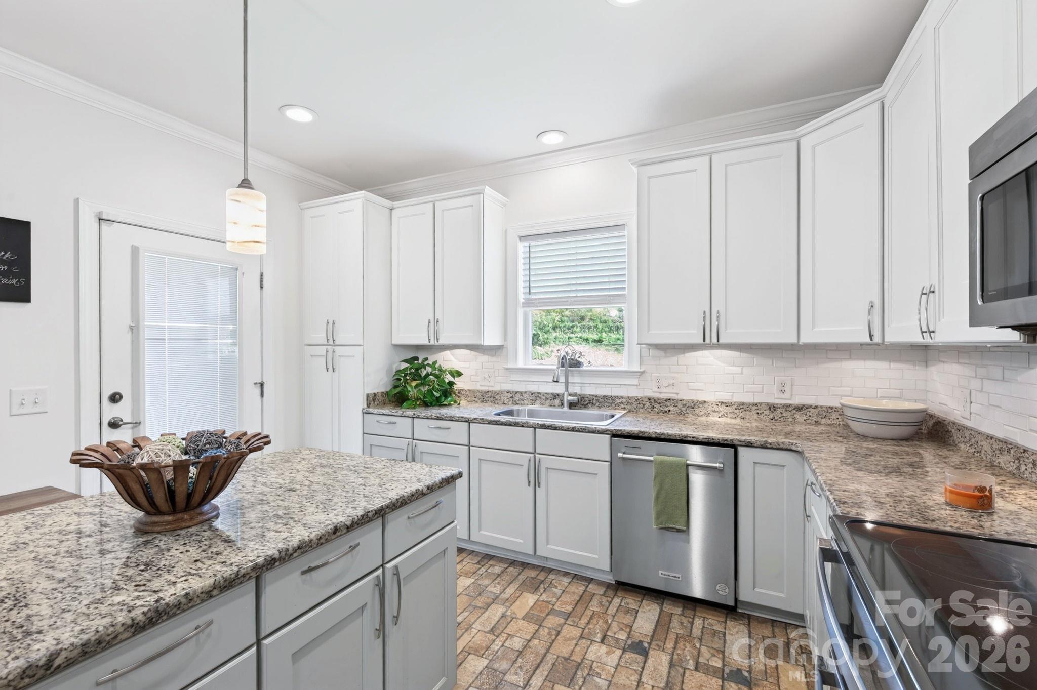 Expansive granite countertops and lovely tile flooring - 10 Hominy Meadows Drive, Candler
