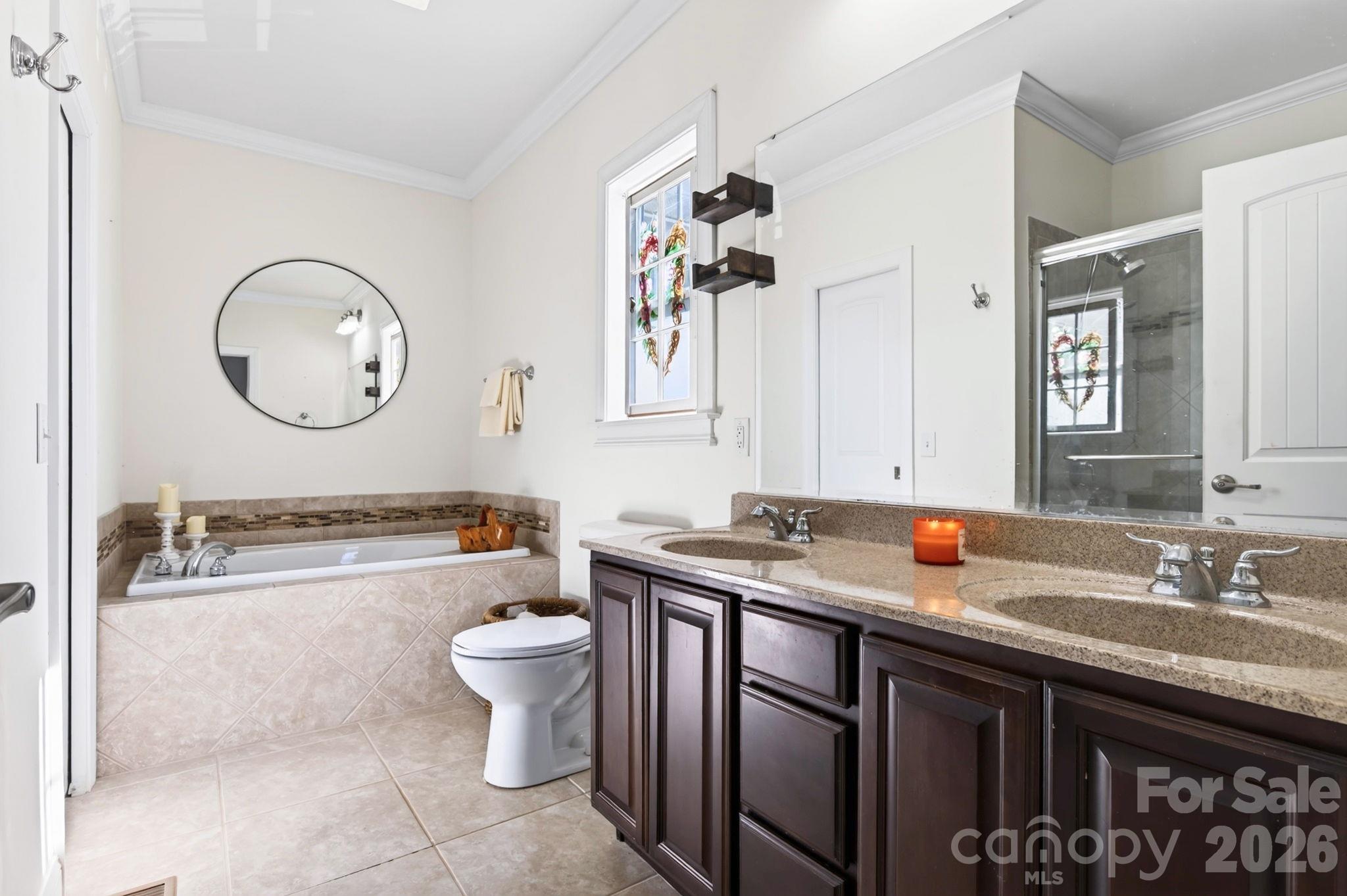 Primary bedroom ensuite bathroom with double sink vanity - 10 Hominy Meadows Drive, Candler
