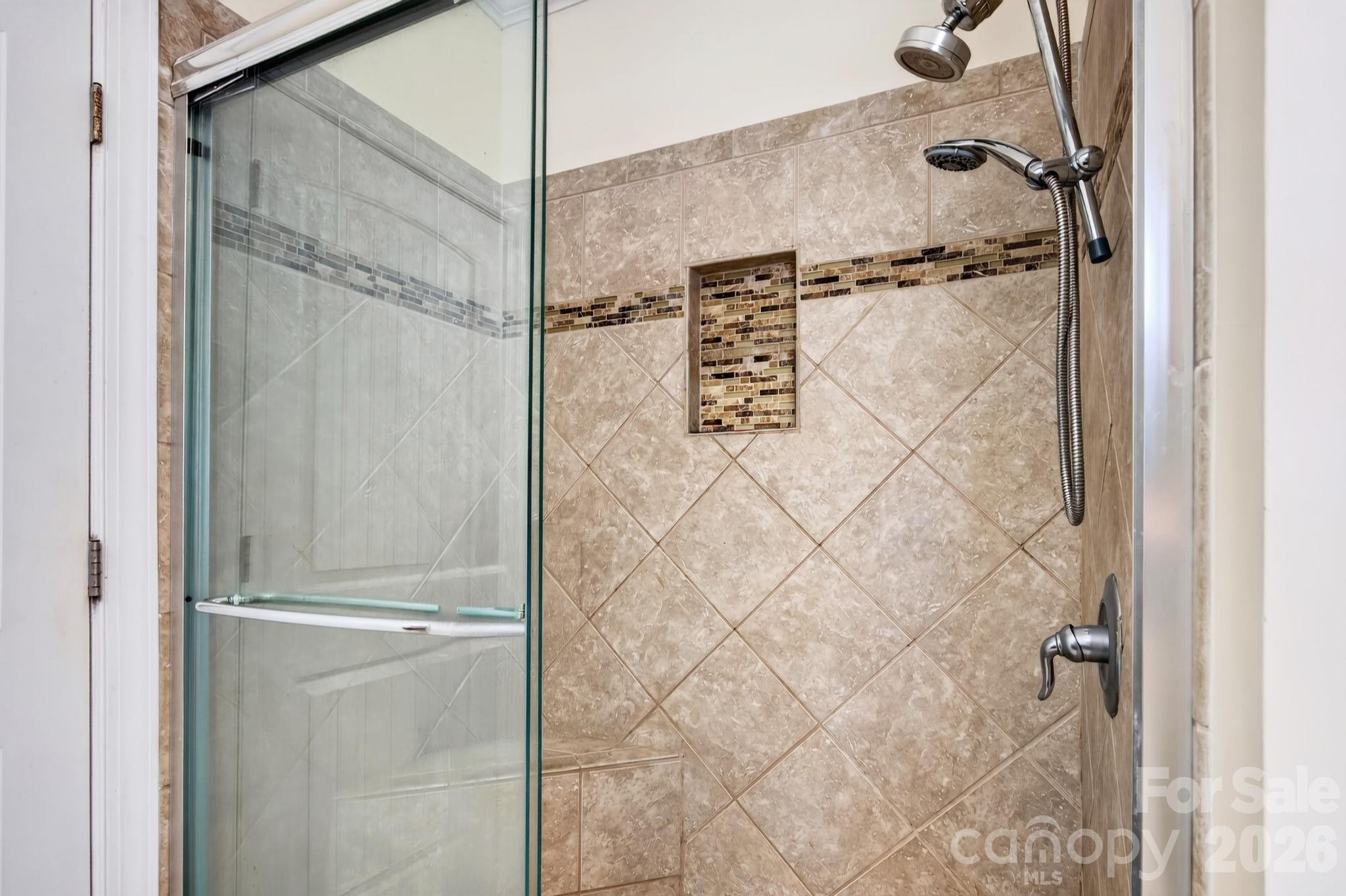 Primary bedroom bathroom with tiled stand-up shower - 10 Hominy Meadows Drive, Candler