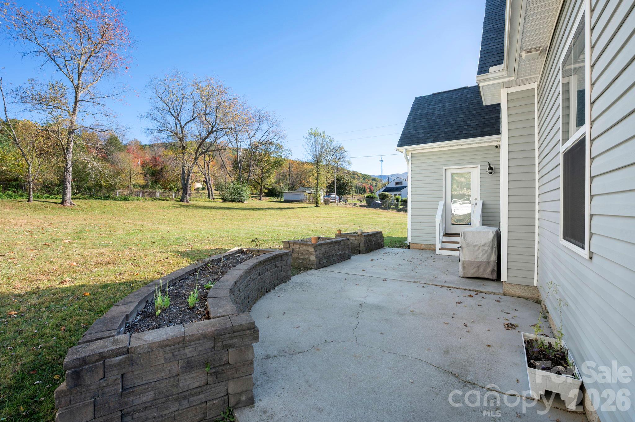 Backyard patio with access from kitchen - 10 Hominy Meadows Drive, Candler