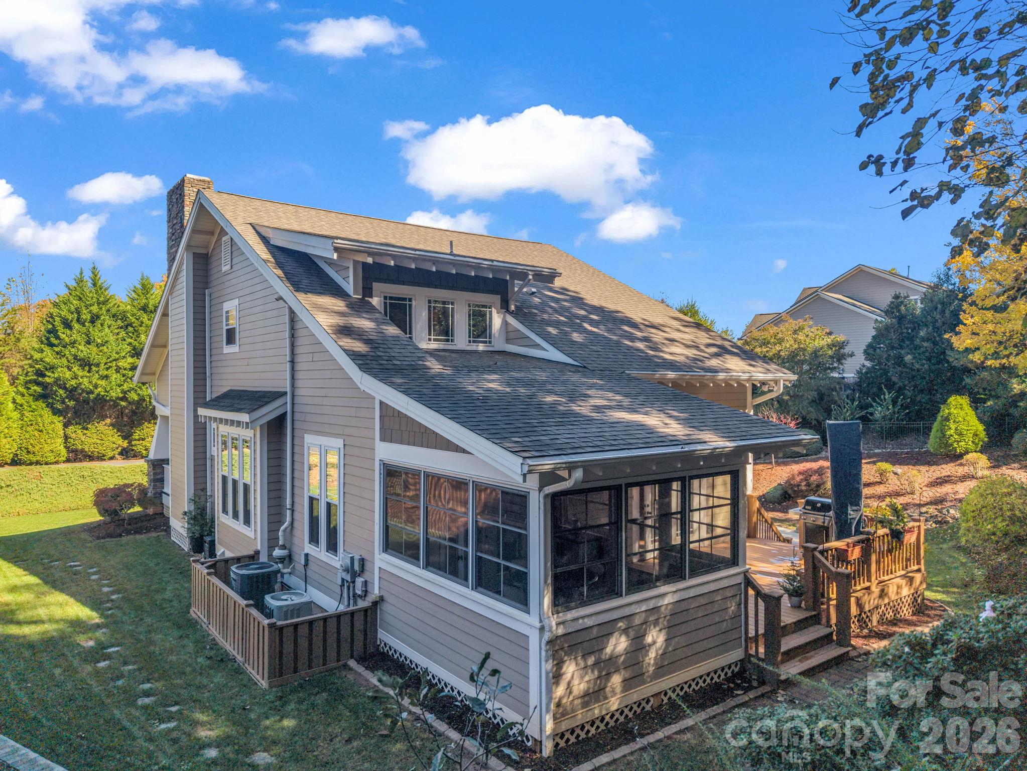 Rear of the home, view of the sunroom and back deck - 376 Scarlet Tanager Court, Arden