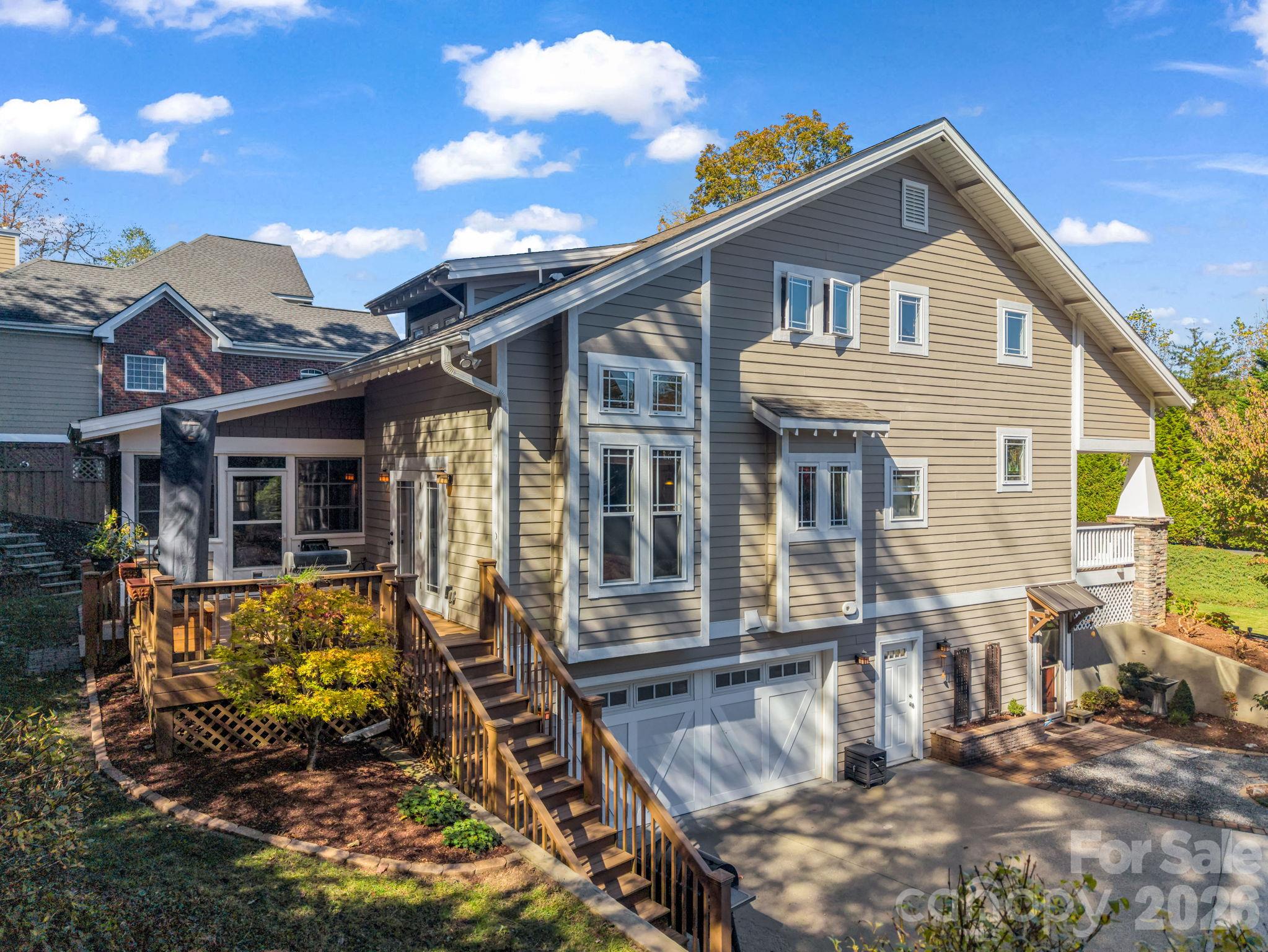 Left side rear of the home showing the deck and privacy - 376 Scarlet Tanager Court, Arden