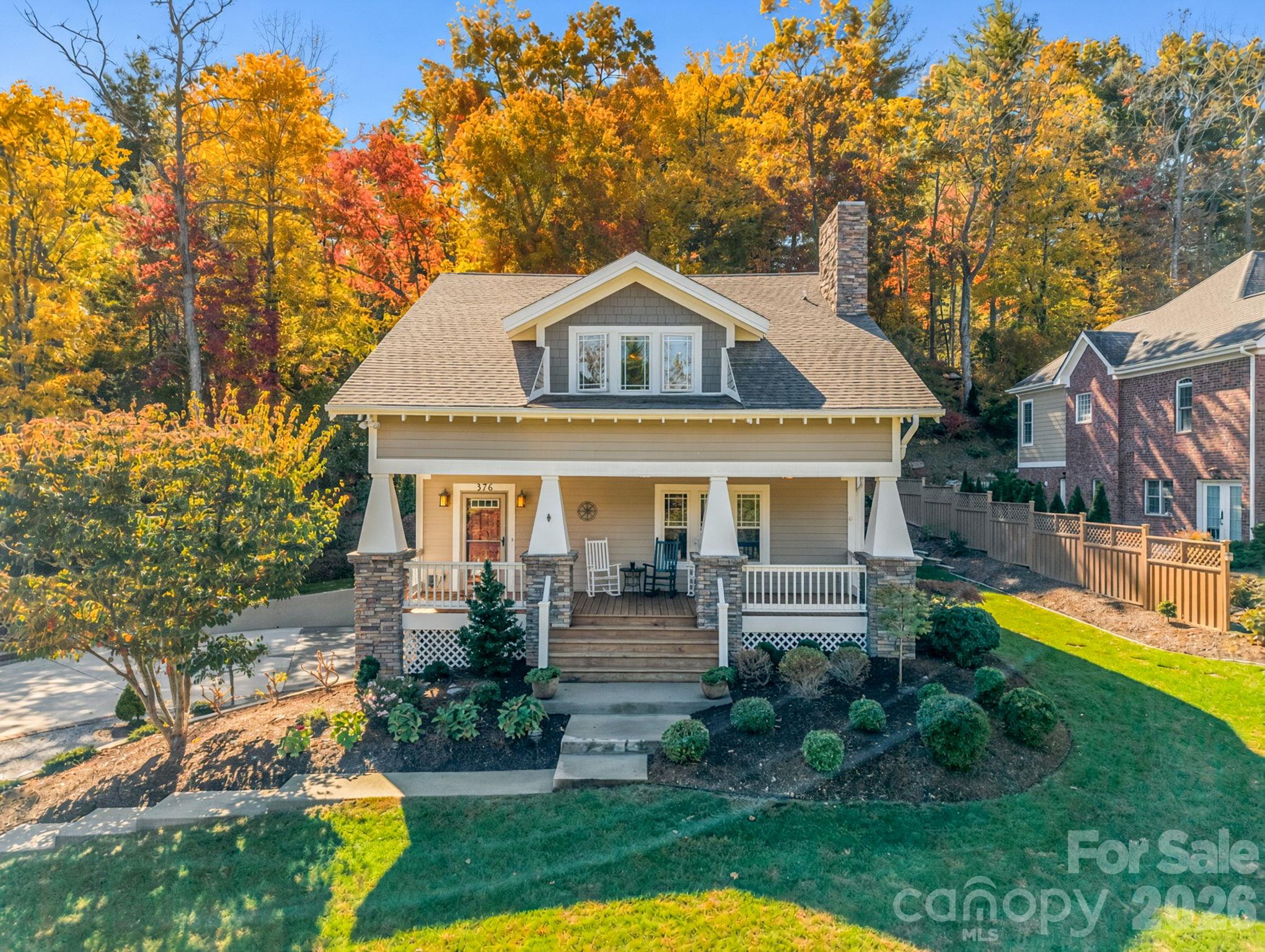 Front view, covered front porch, beautiful landscaping - 376 Scarlet Tanager Court, Arden