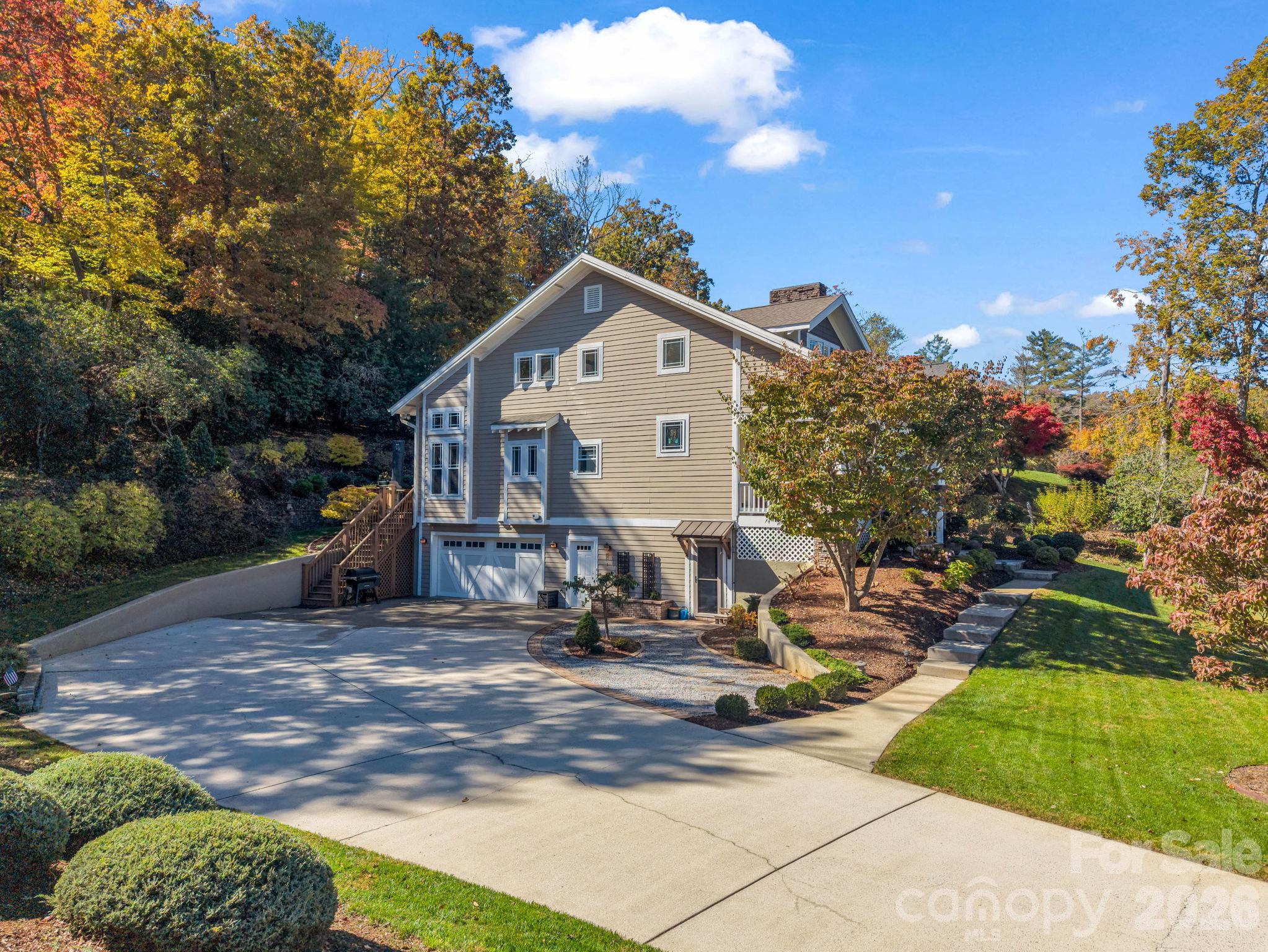 Left front and spacious concrete driveway - 376 Scarlet Tanager Court, Arden