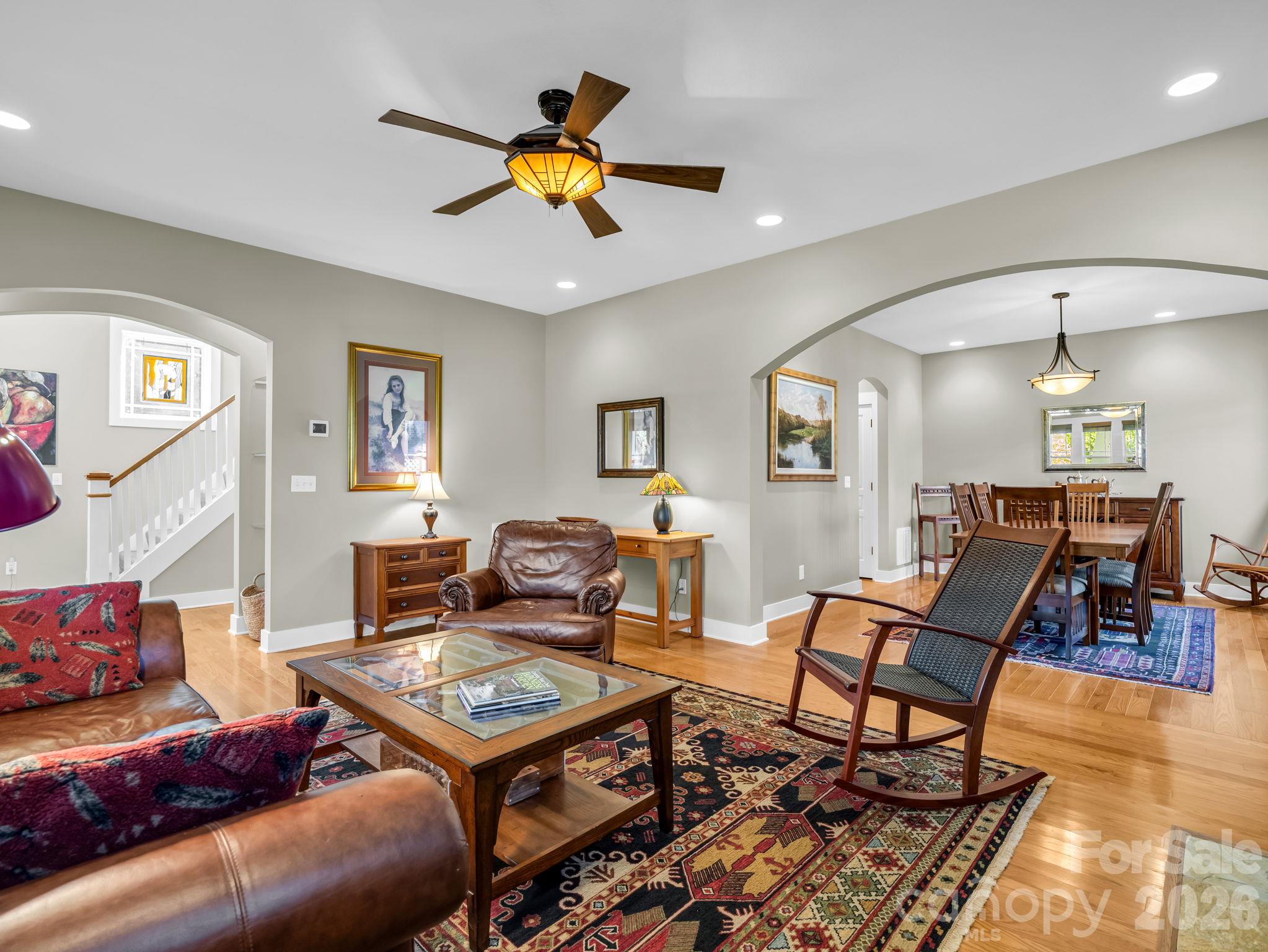 Arched doorways and open floor plan, living room - 376 Scarlet Tanager Court, Arden
