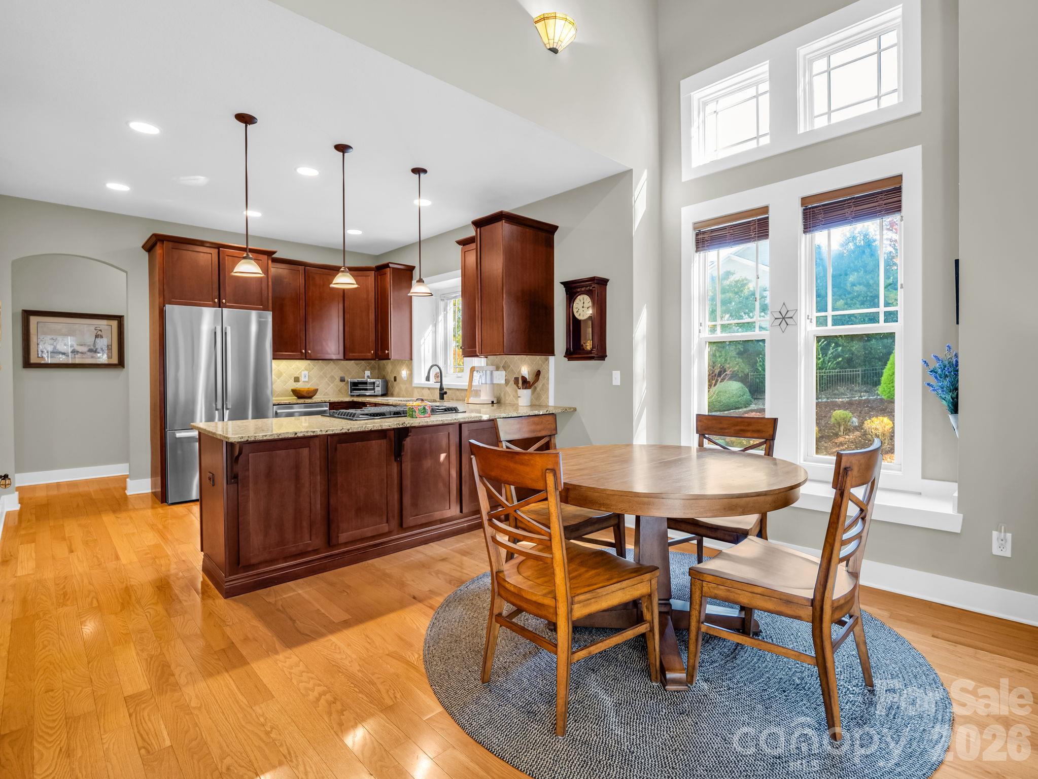 Breakfast area looking into the open kitchen - 376 Scarlet Tanager Court, Arden