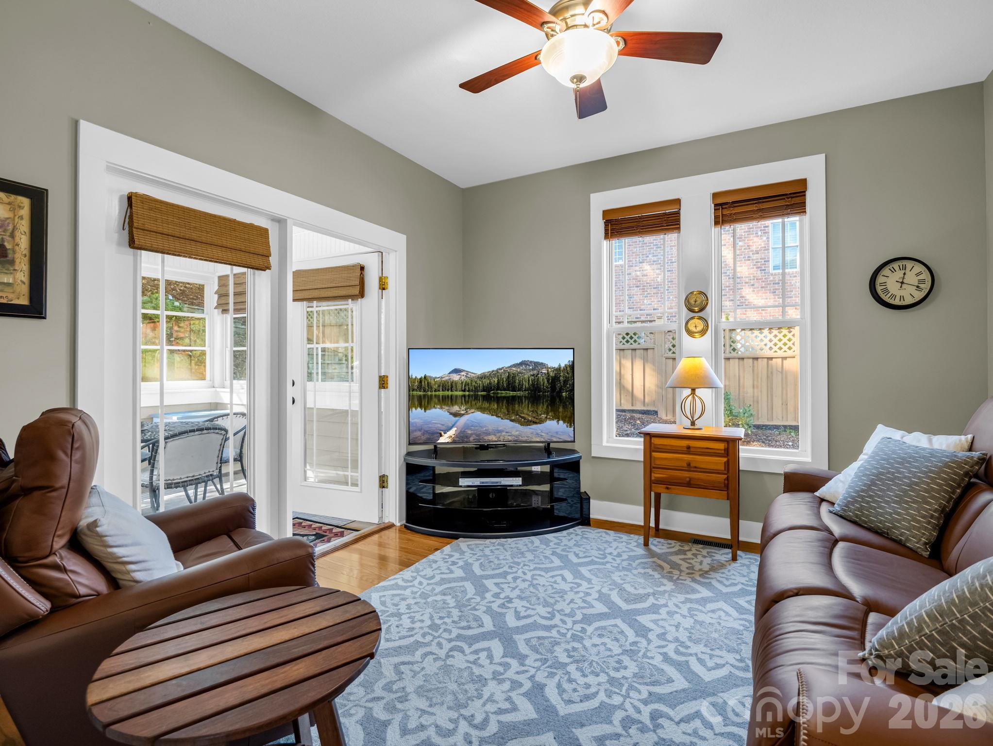 Sitting room in rear of the home will be a favorite hang out spot, just beyond is the sunroom - 376 Scarlet Tanager Court, Arden